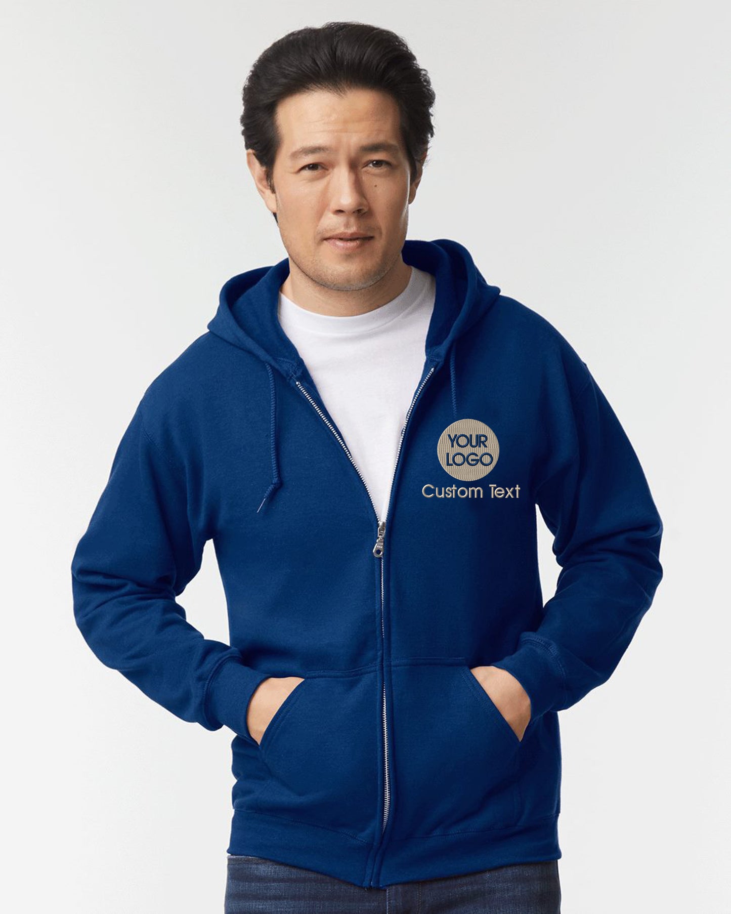 a man in a blue hoodie with his hands on his hips