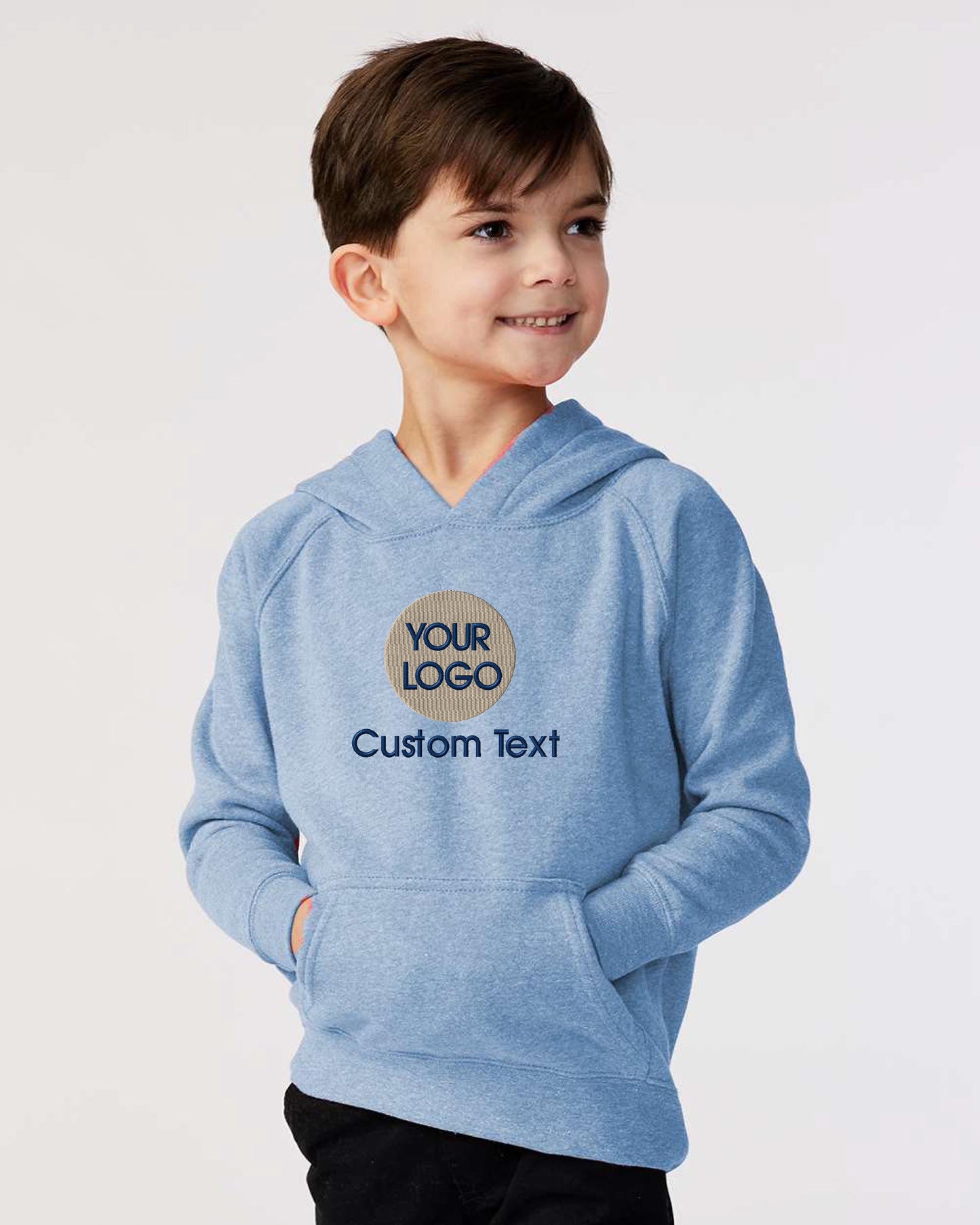 a young boy wearing a blue hoodie with a logo on it