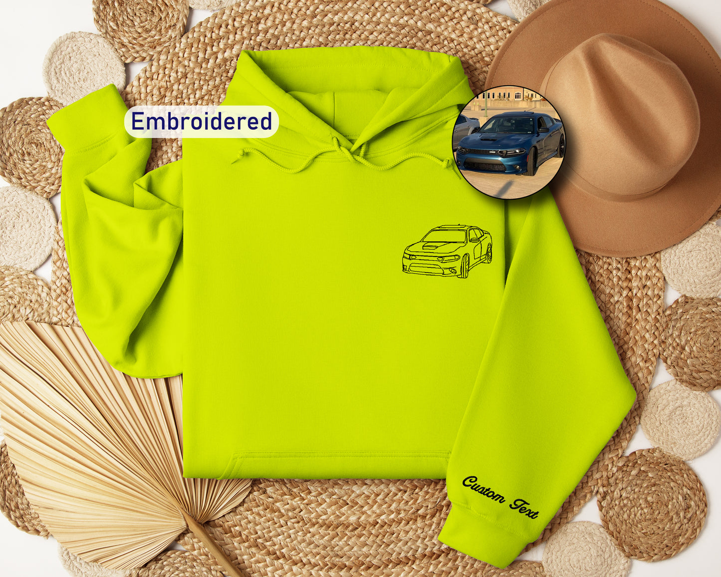 a yellow hoodie with a picture of a car on it