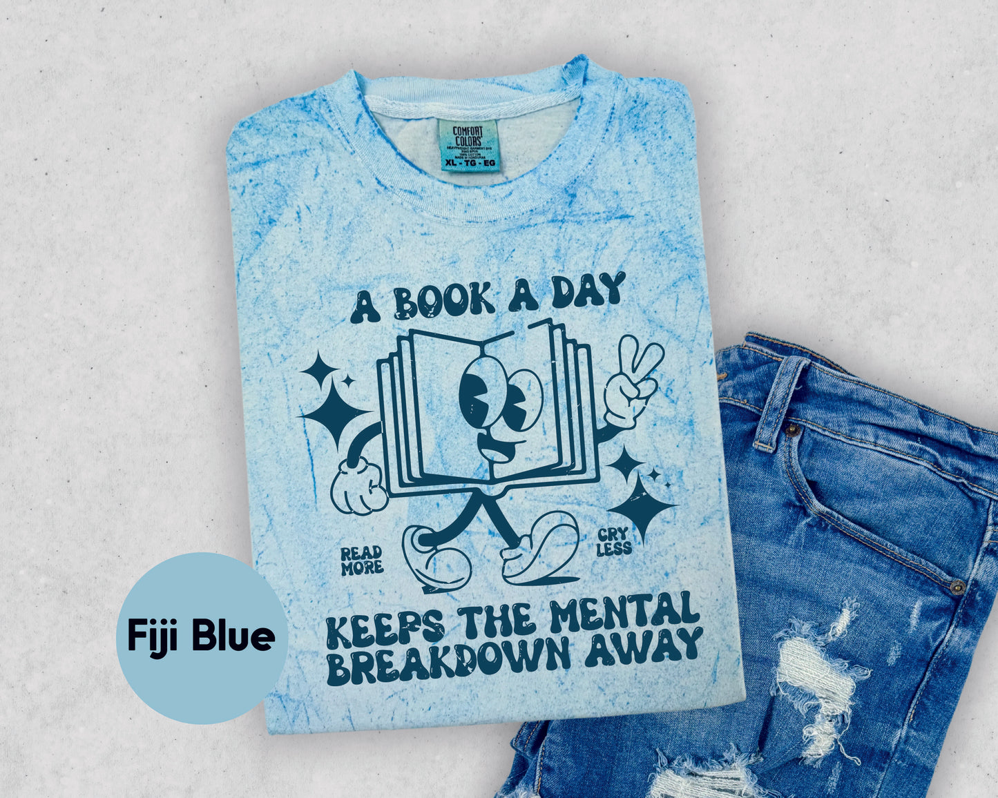 a t - shirt that says, a book a day keeps the mental breakdown