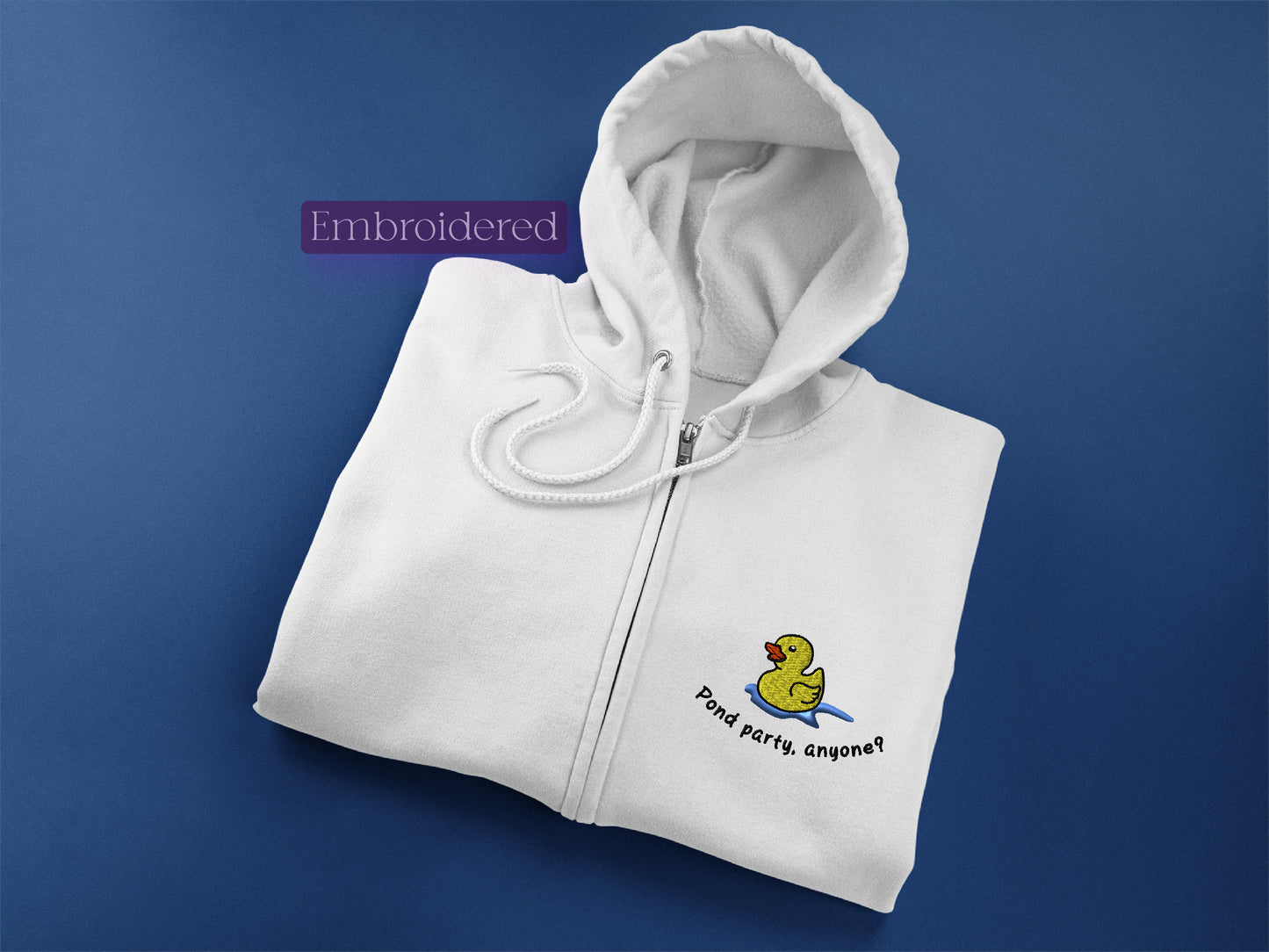 a white hoodie with a rubber ducky embroidered on it