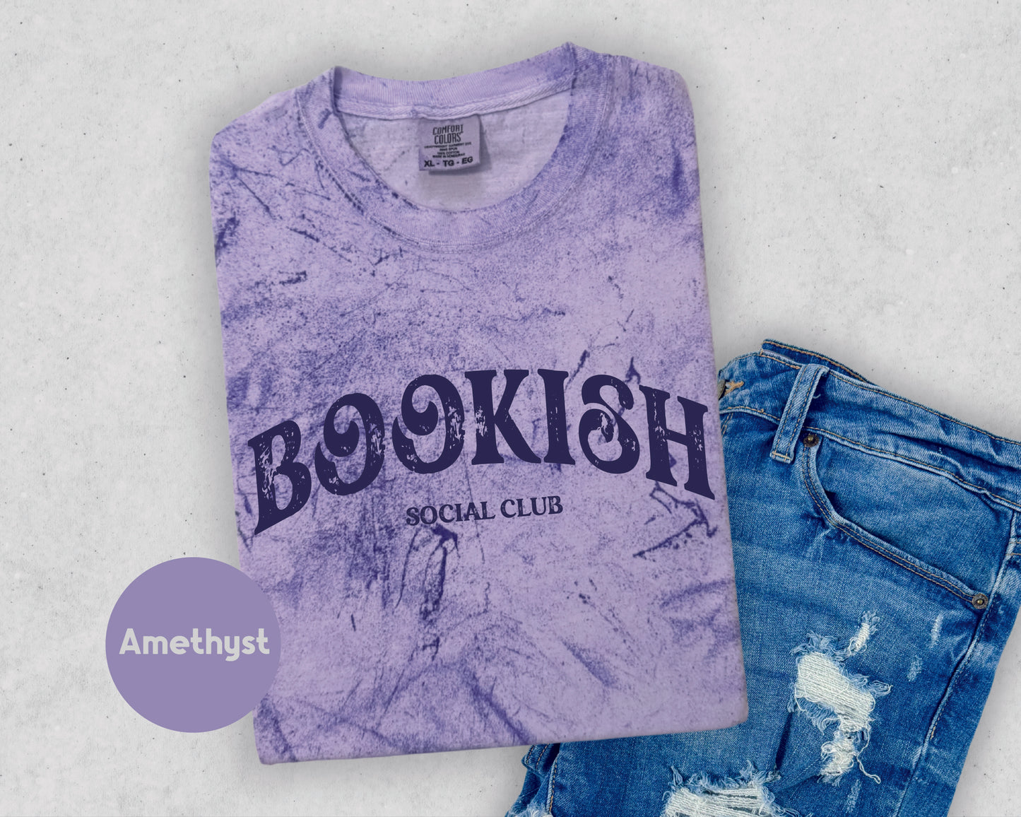 a t - shirt with the words bookish on it next to a pair of