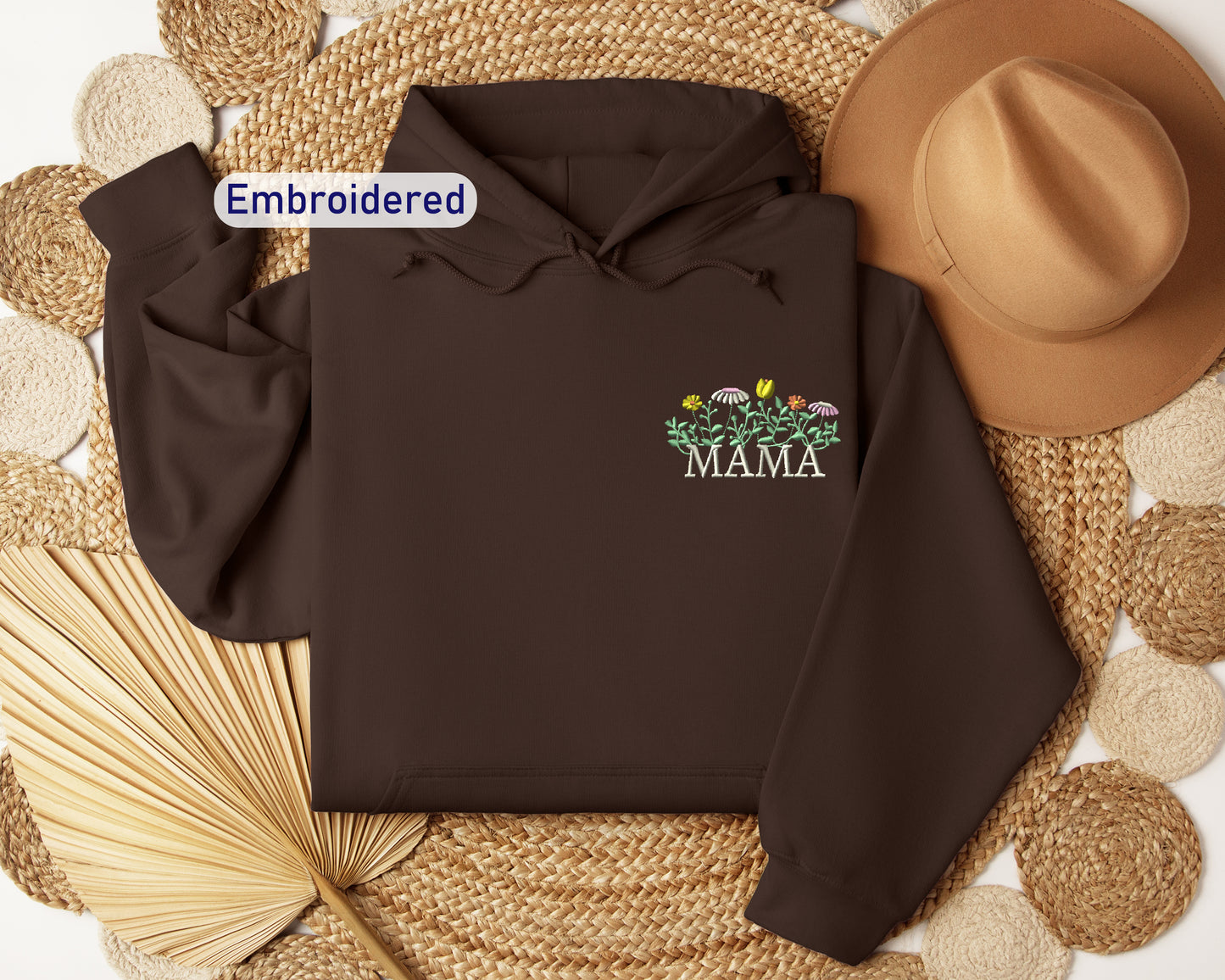 a brown hoodie with the words embroidered on it