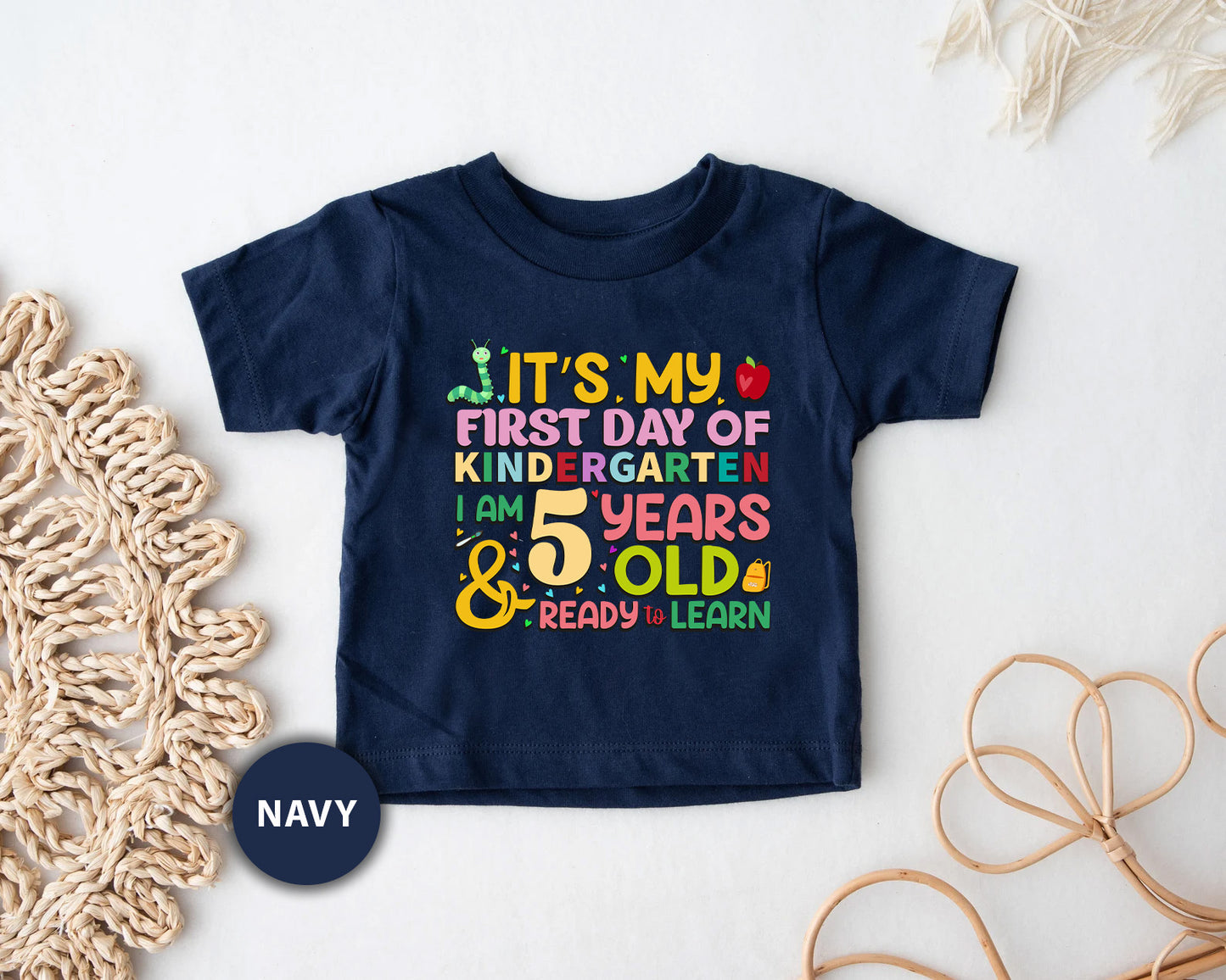 a t - shirt that says it's my first day of school and five