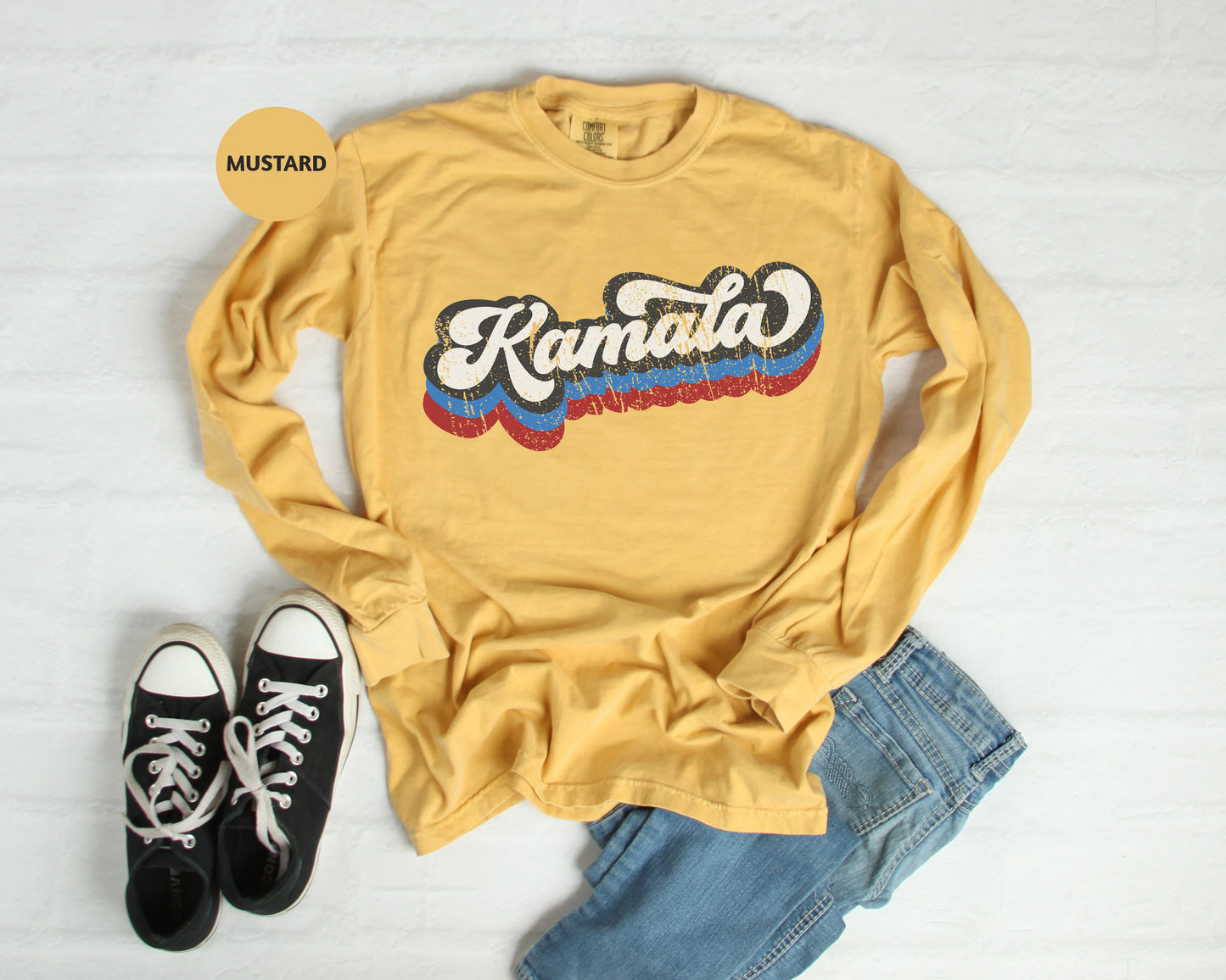 a yellow shirt with the word kanata on it and a pair of black sneakers