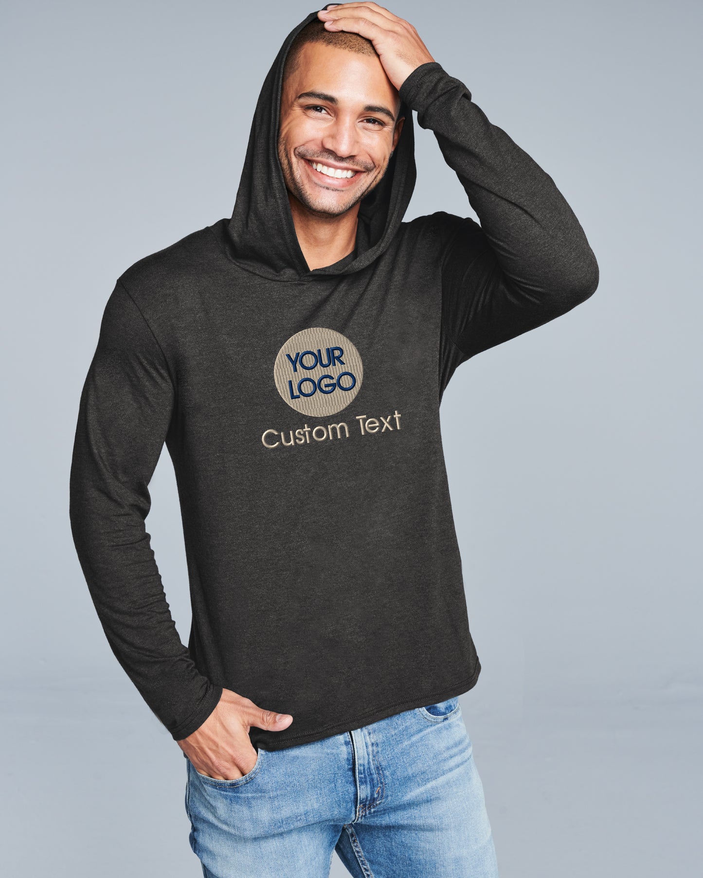 a man wearing a black hoodie with a logo on it