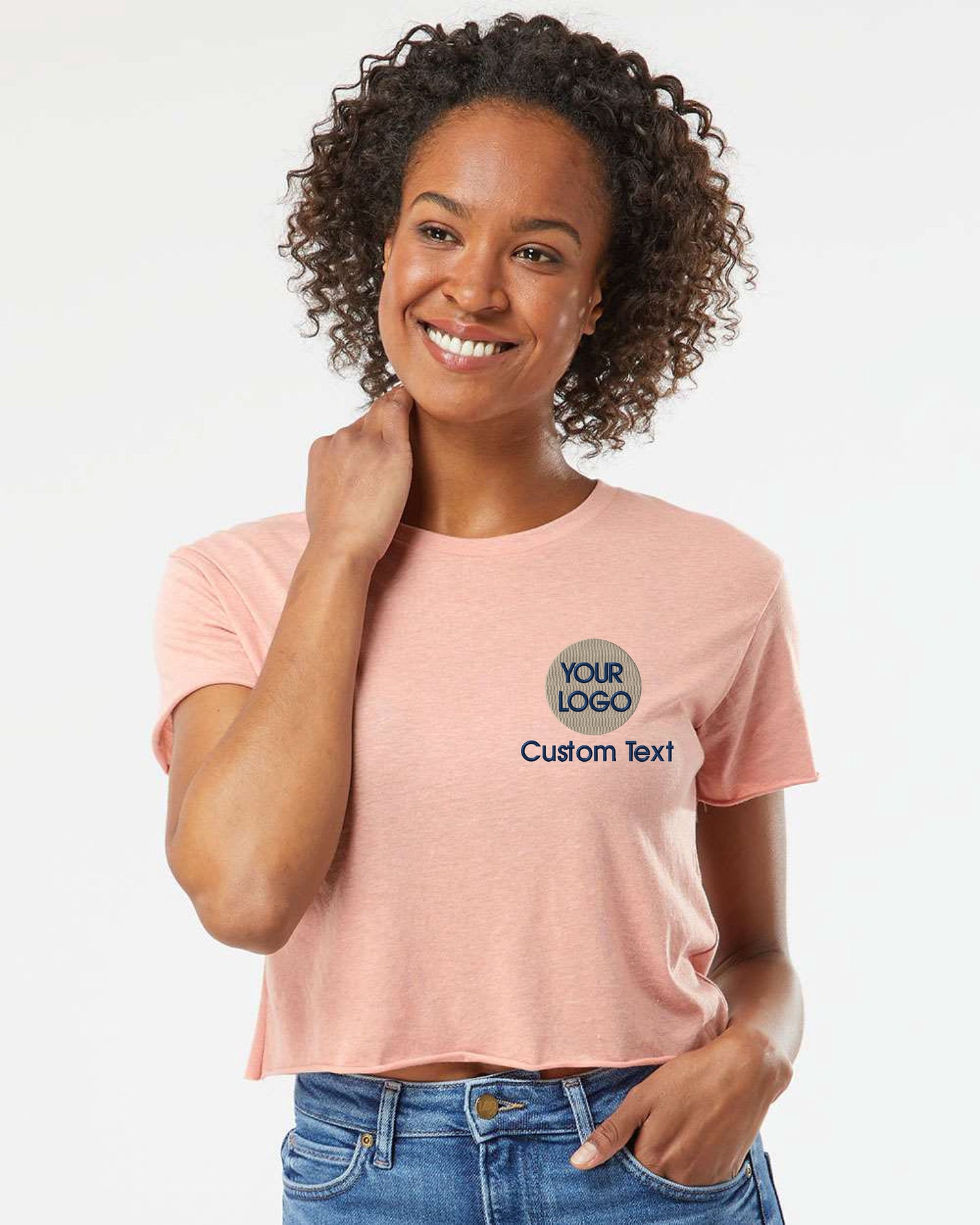 a woman wearing a pink shirt and jeans