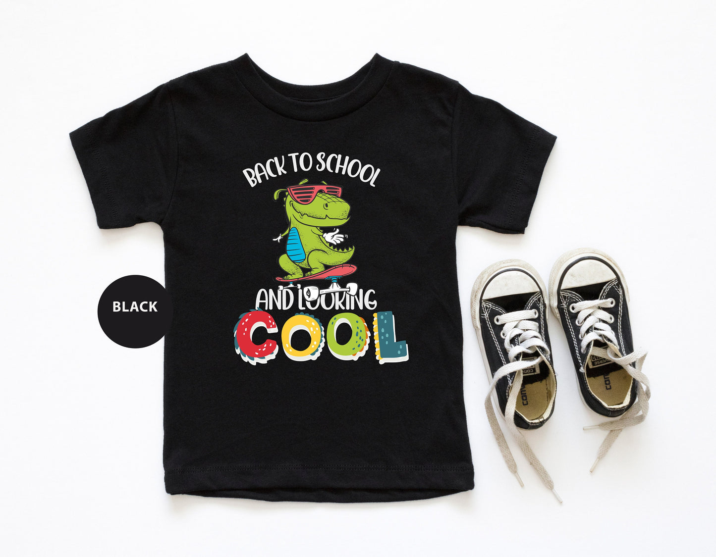 a pair of sneakers and a t - shirt with the words back to school and