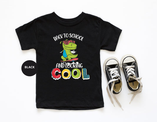a pair of sneakers and a t - shirt with the words back to school and