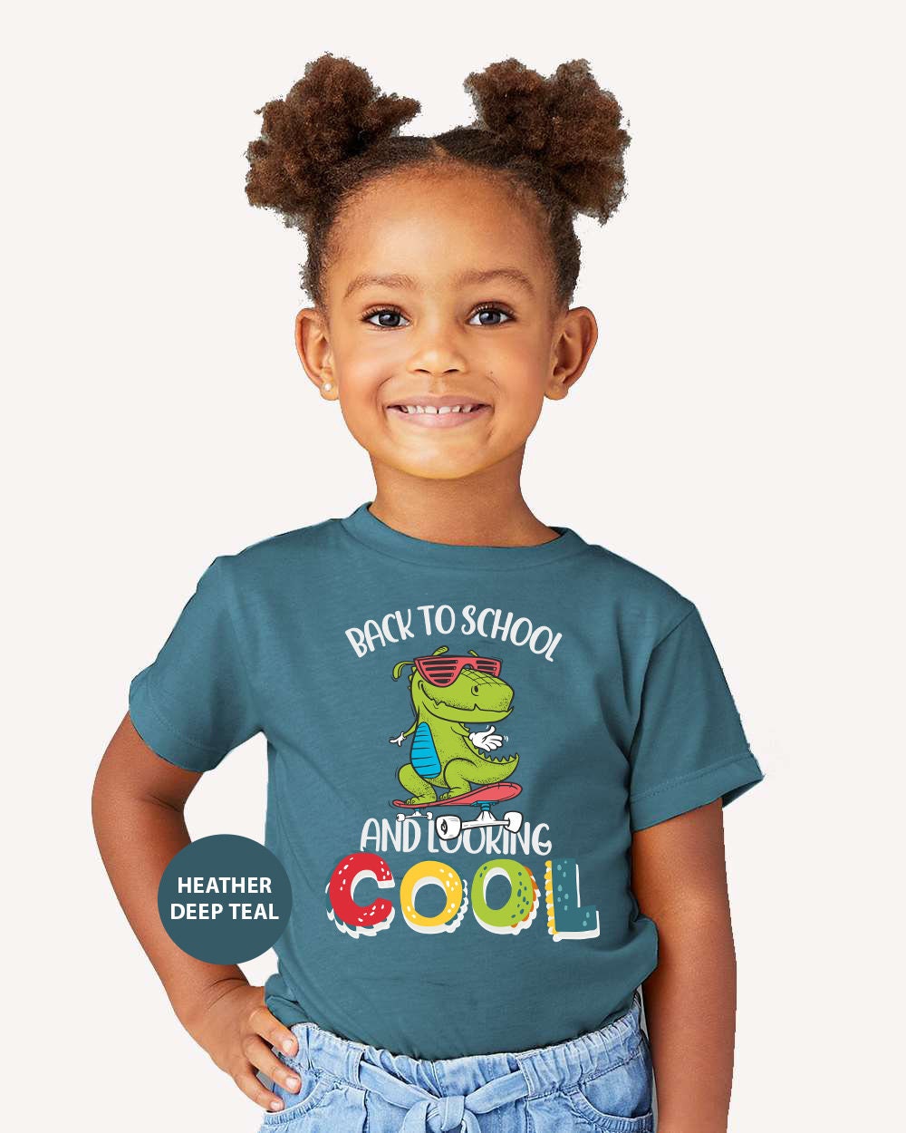 a little girl wearing a back to school shirt