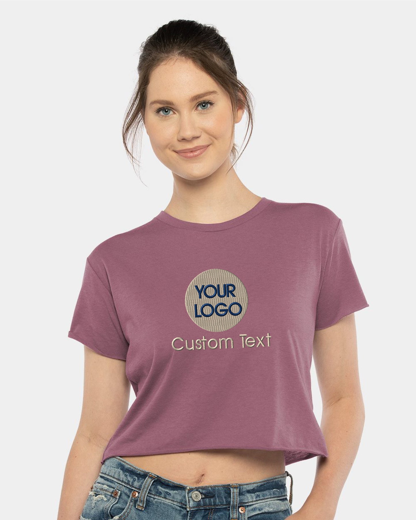 a woman wearing a crop top with the words your logo on it