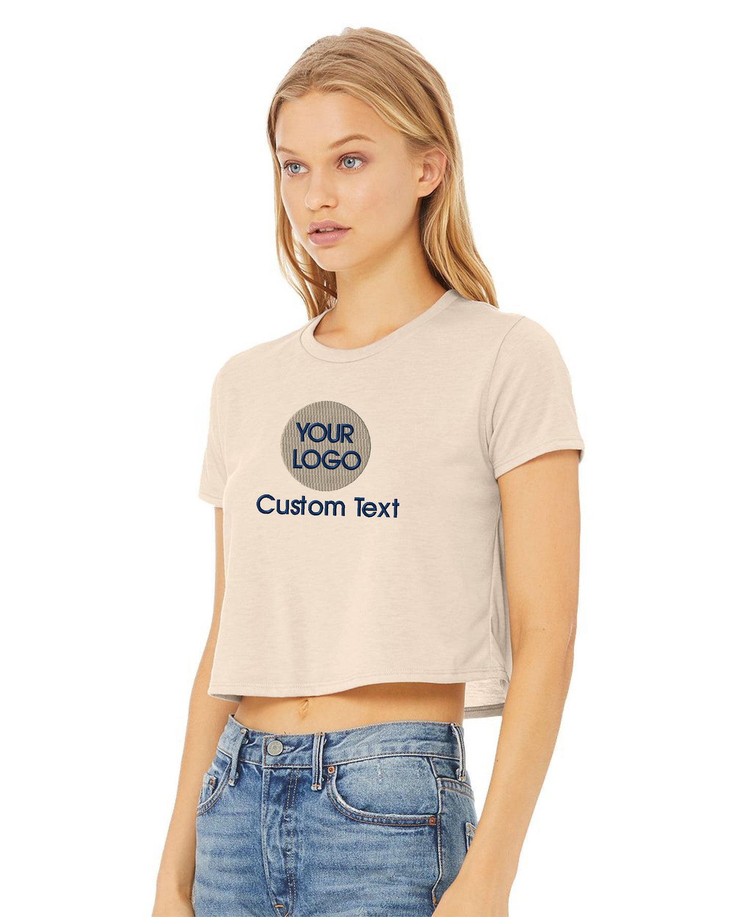 a woman wearing a cropped crop top and jeans