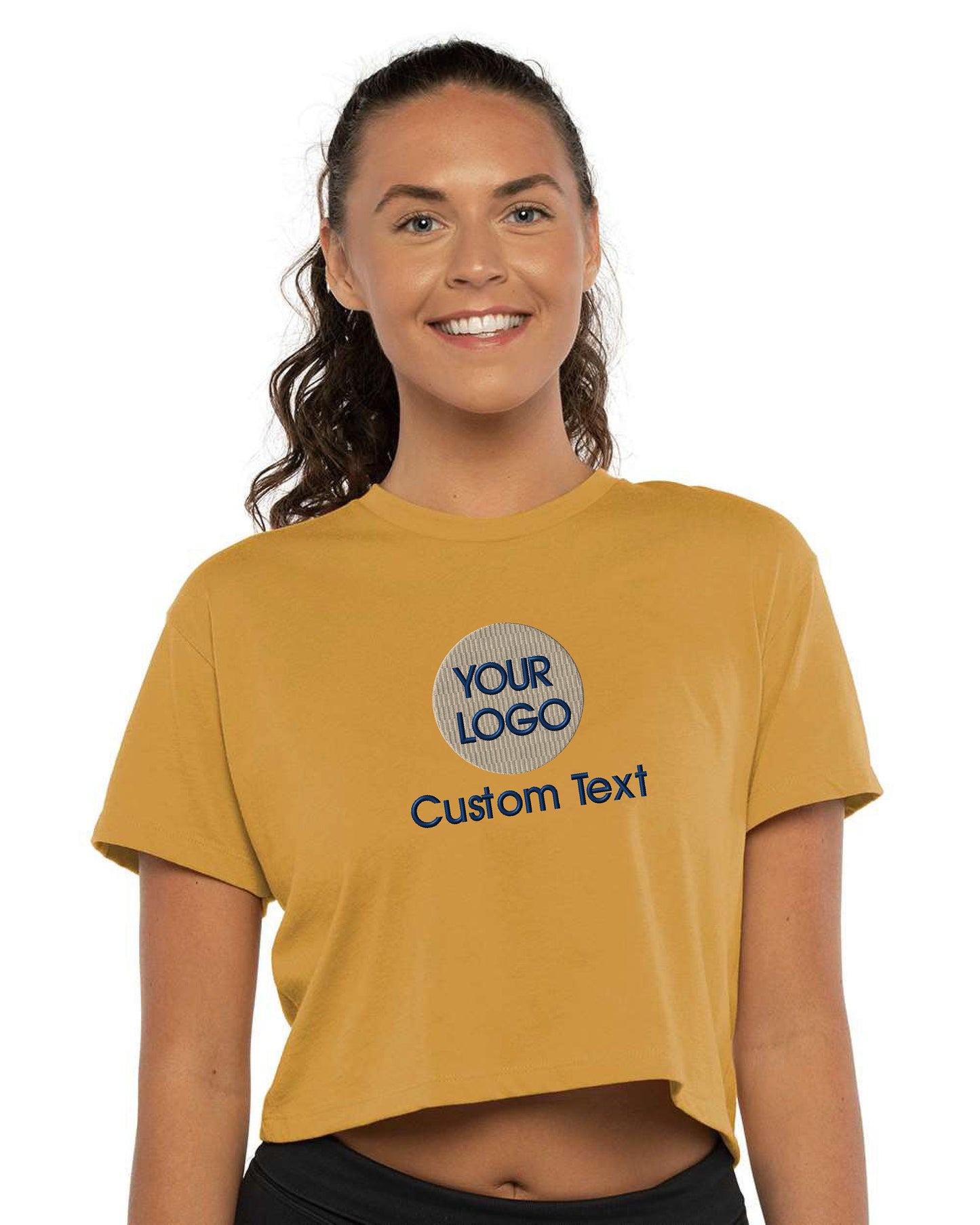 a woman wearing a crop top that says your logo on it