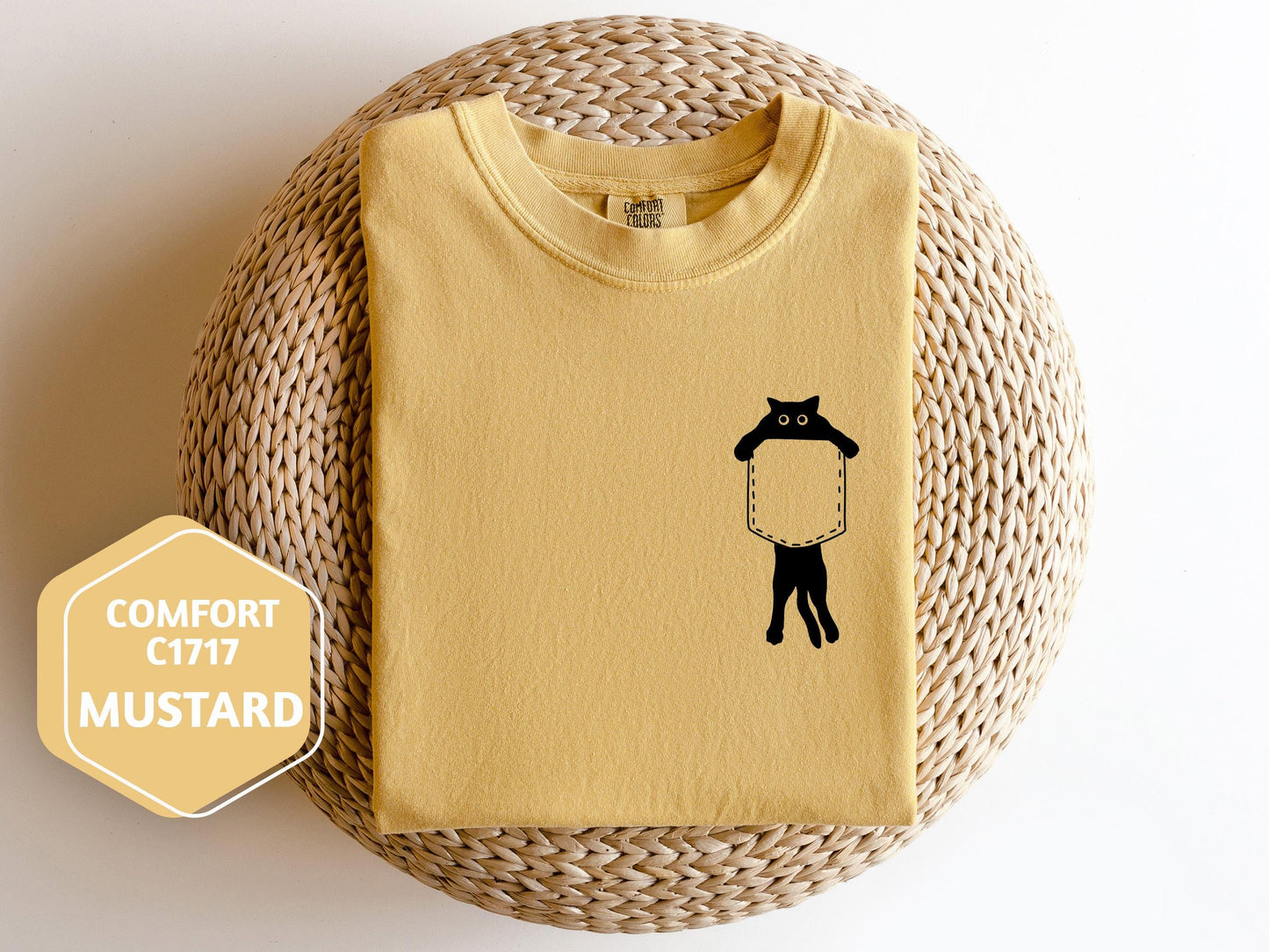 a yellow shirt with a black cat on it
