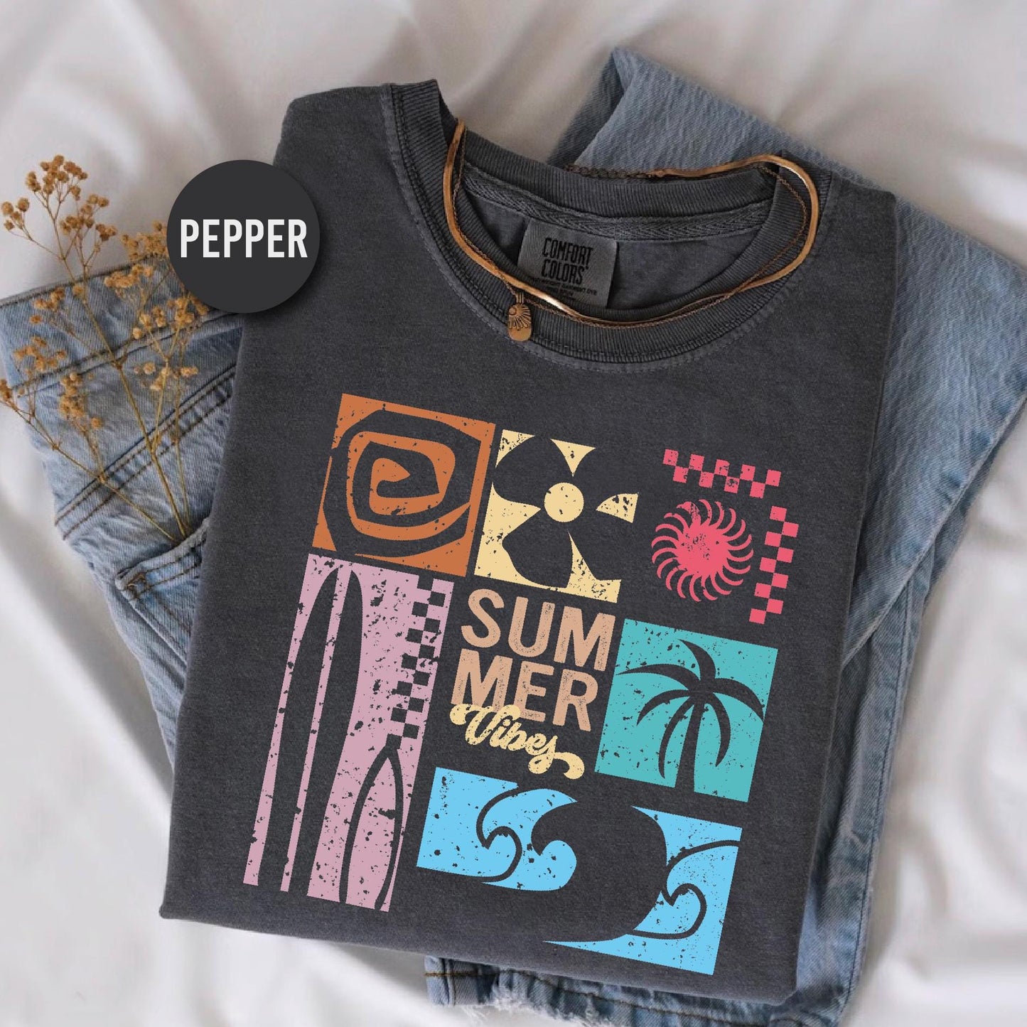 a t - shirt that says summer is here on it