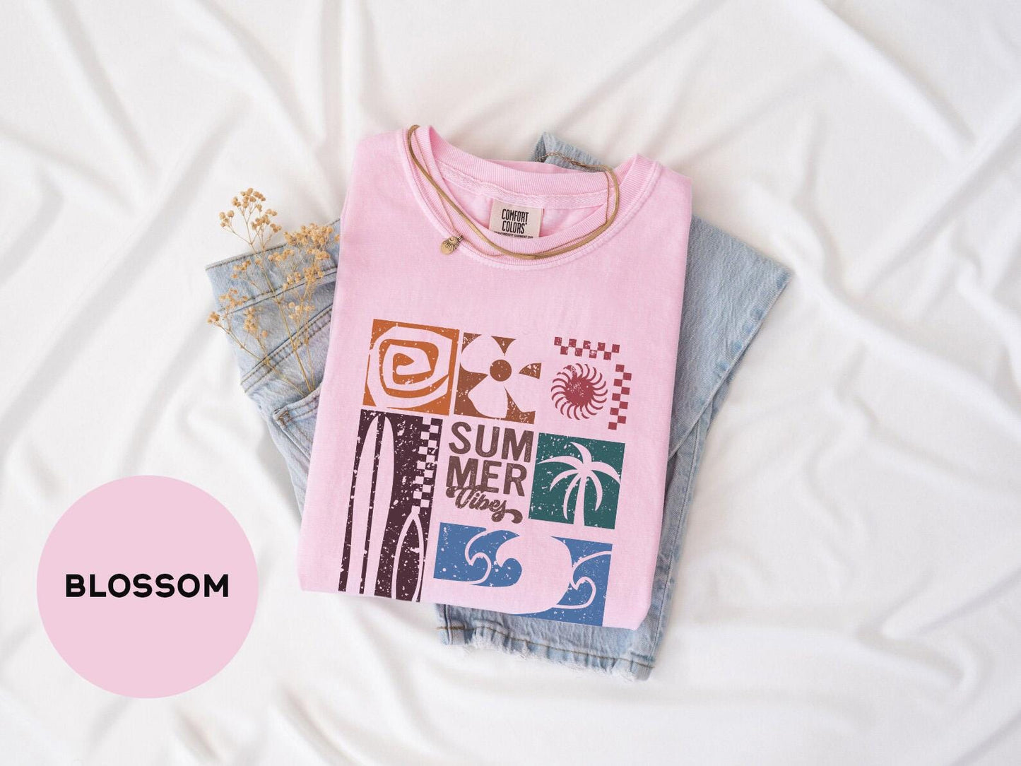 a pink shirt with a picture of a palm tree on it