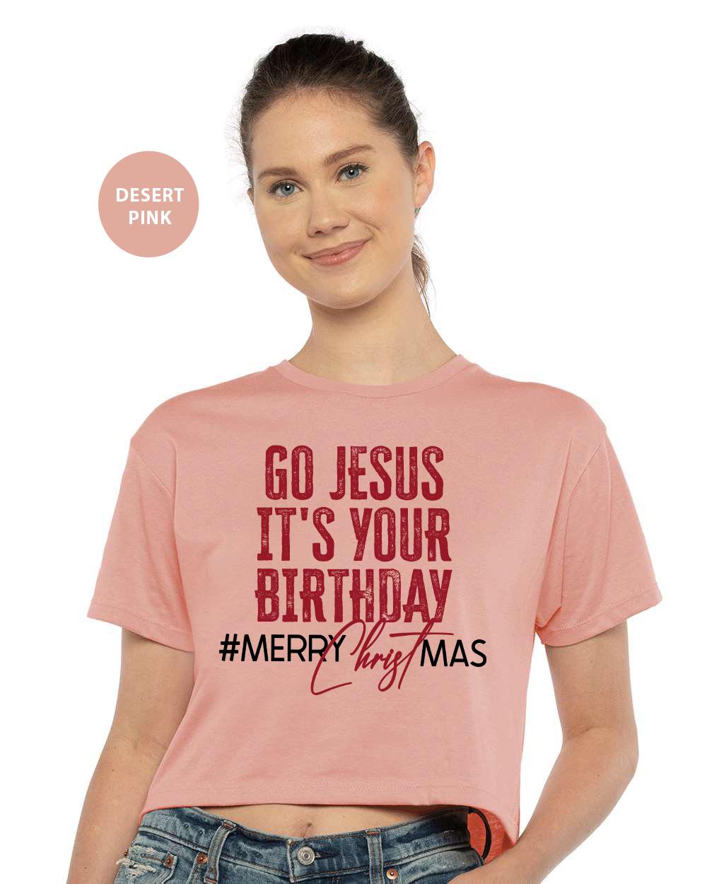 a woman wearing a pink shirt that says go jesus it's your birthday merry
