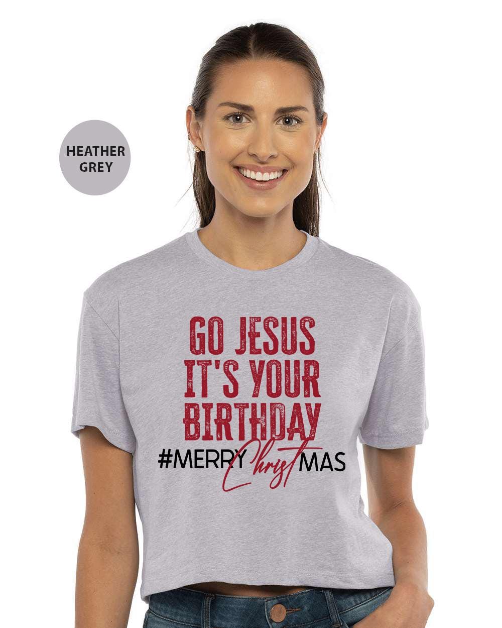 a woman wearing a t - shirt that says go jesus it's your birthday
