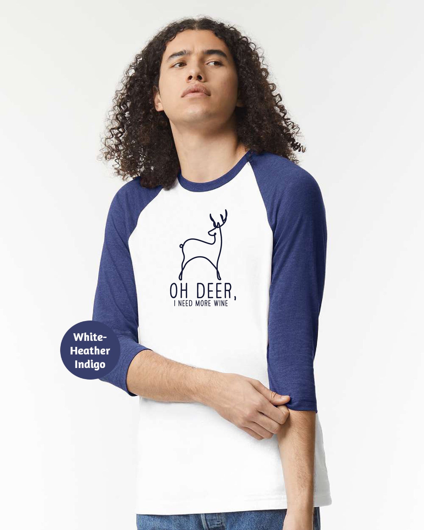 a man wearing a white and blue shirt with a deer on it