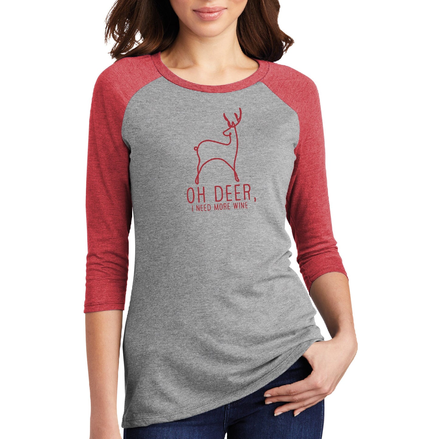 a woman wearing a grey and red shirt with a deer on it