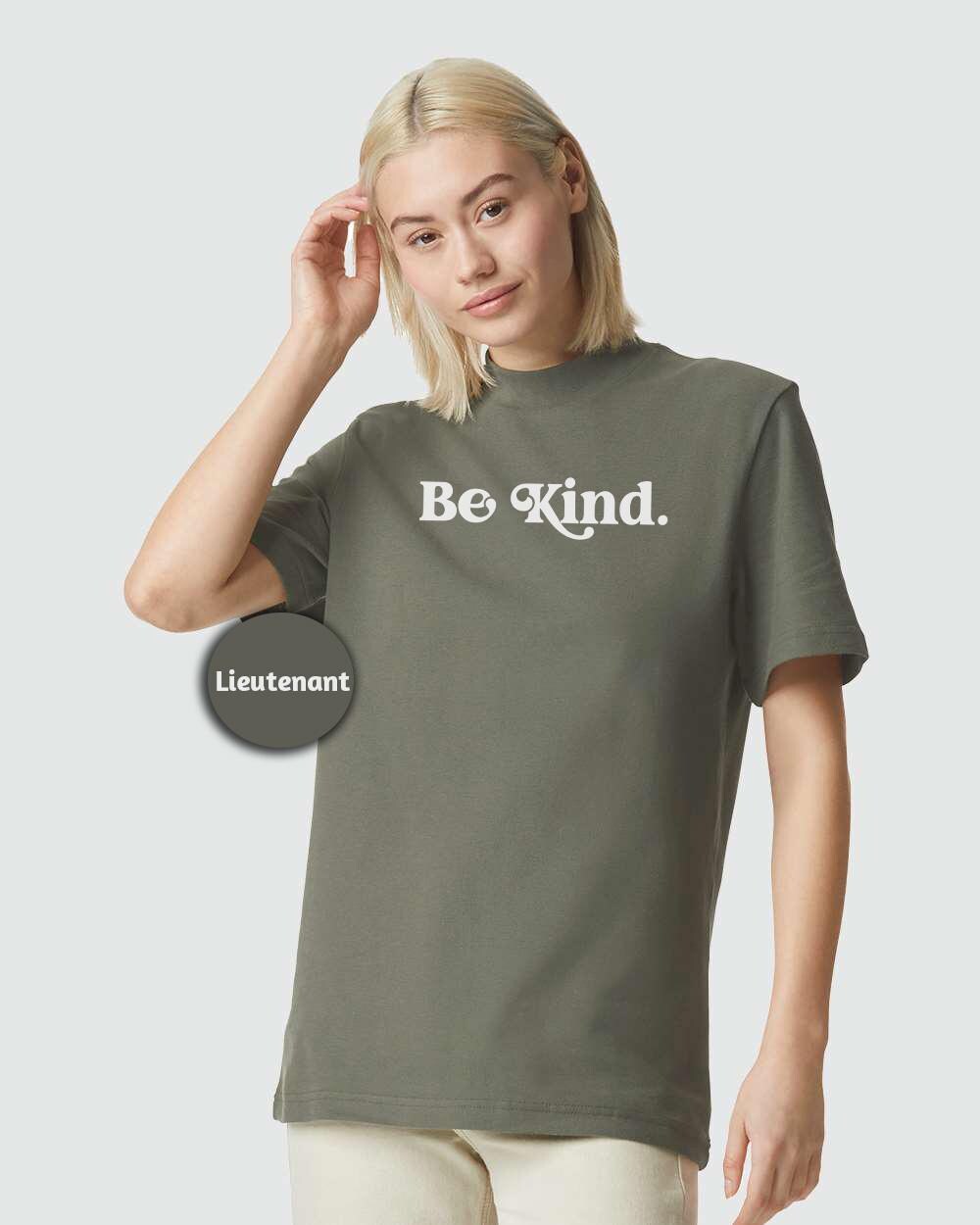 a woman wearing a be kind t - shirt