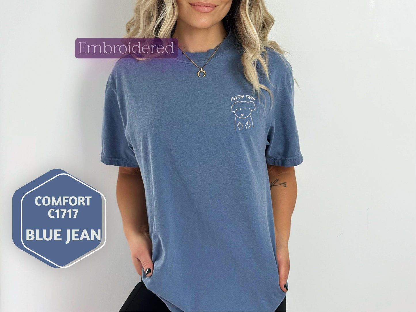 a woman with blonde hair wearing a blue shirt