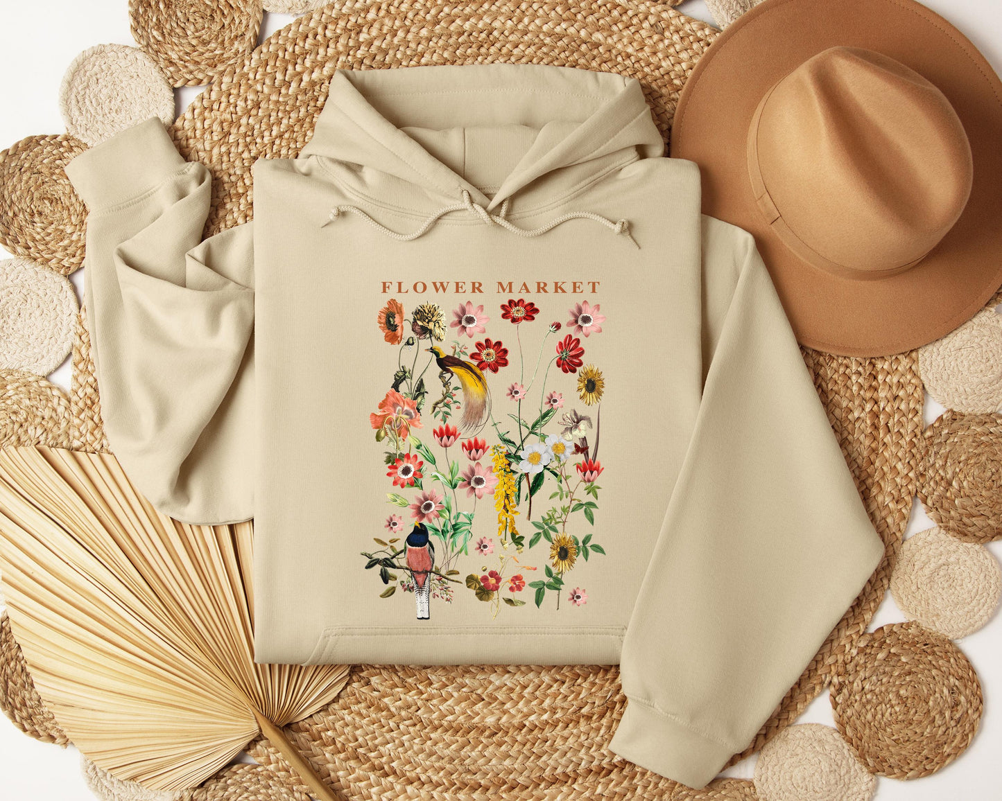 a hoodie with a picture of a flower market on it