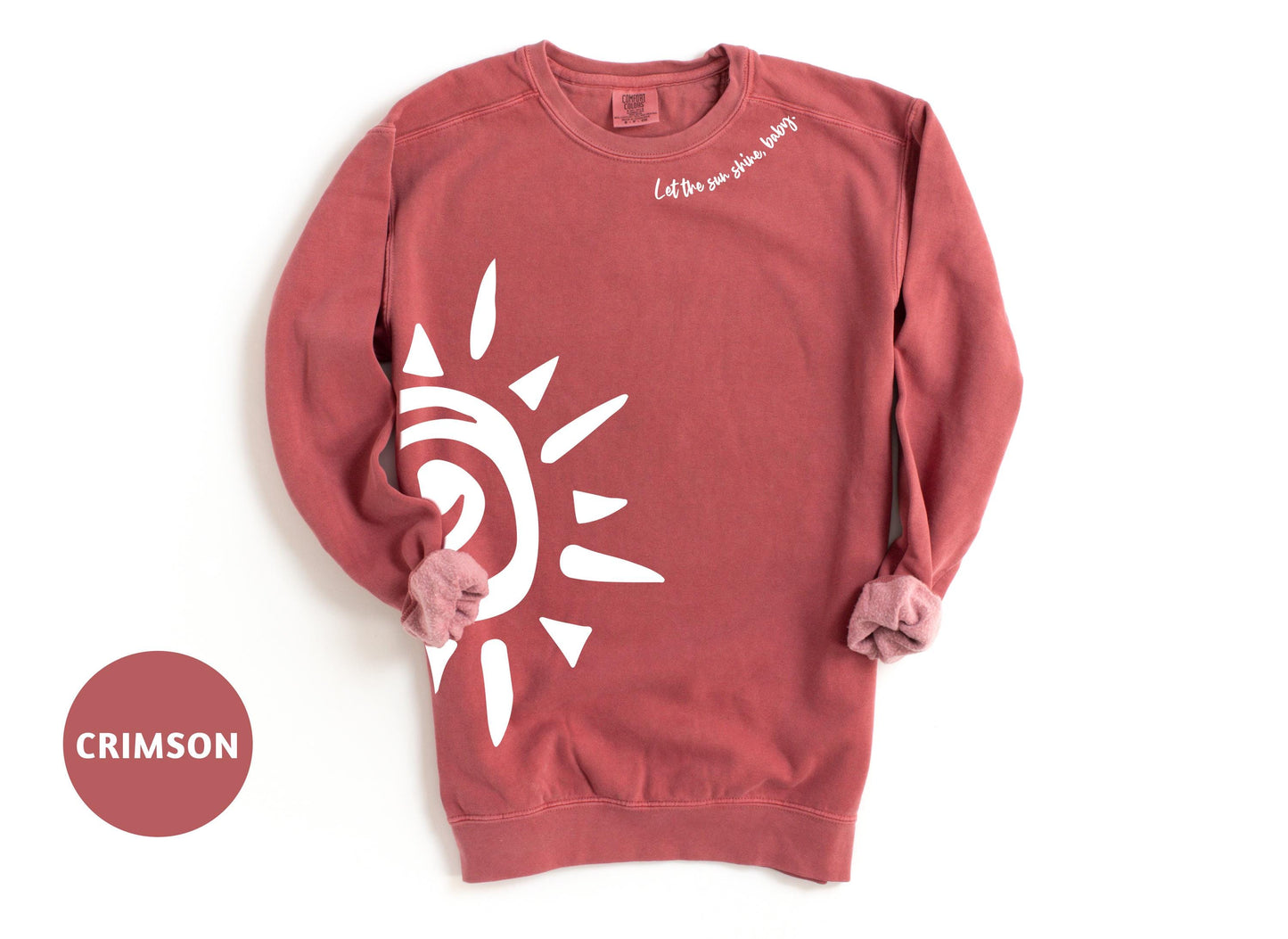 a red sweatshirt with a white sun on it