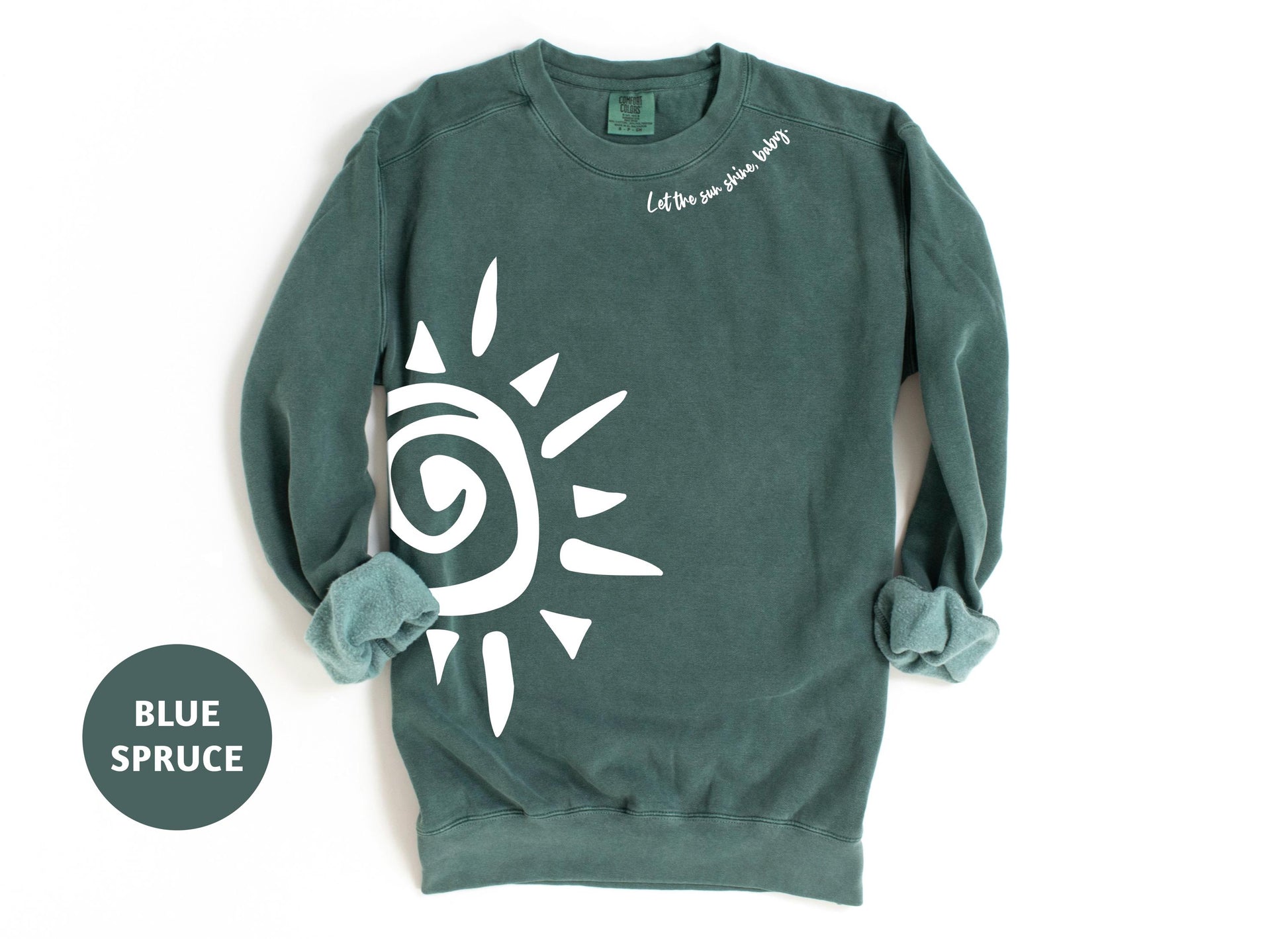 a green sweatshirt with a white sun on it