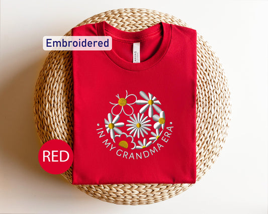a red t - shirt with the words red embroidered on it
