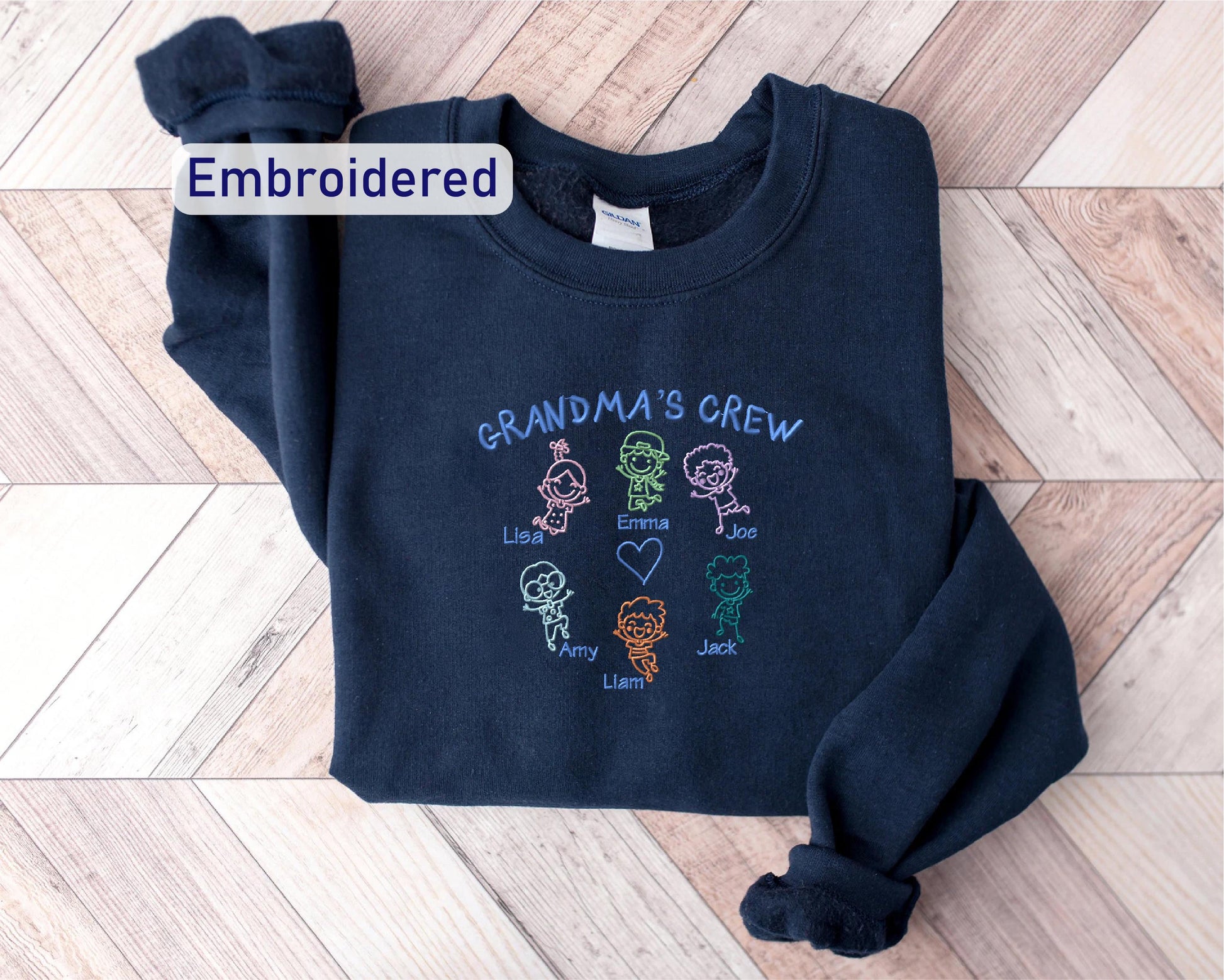 a blue sweatshirt with the words grandma's crew on it