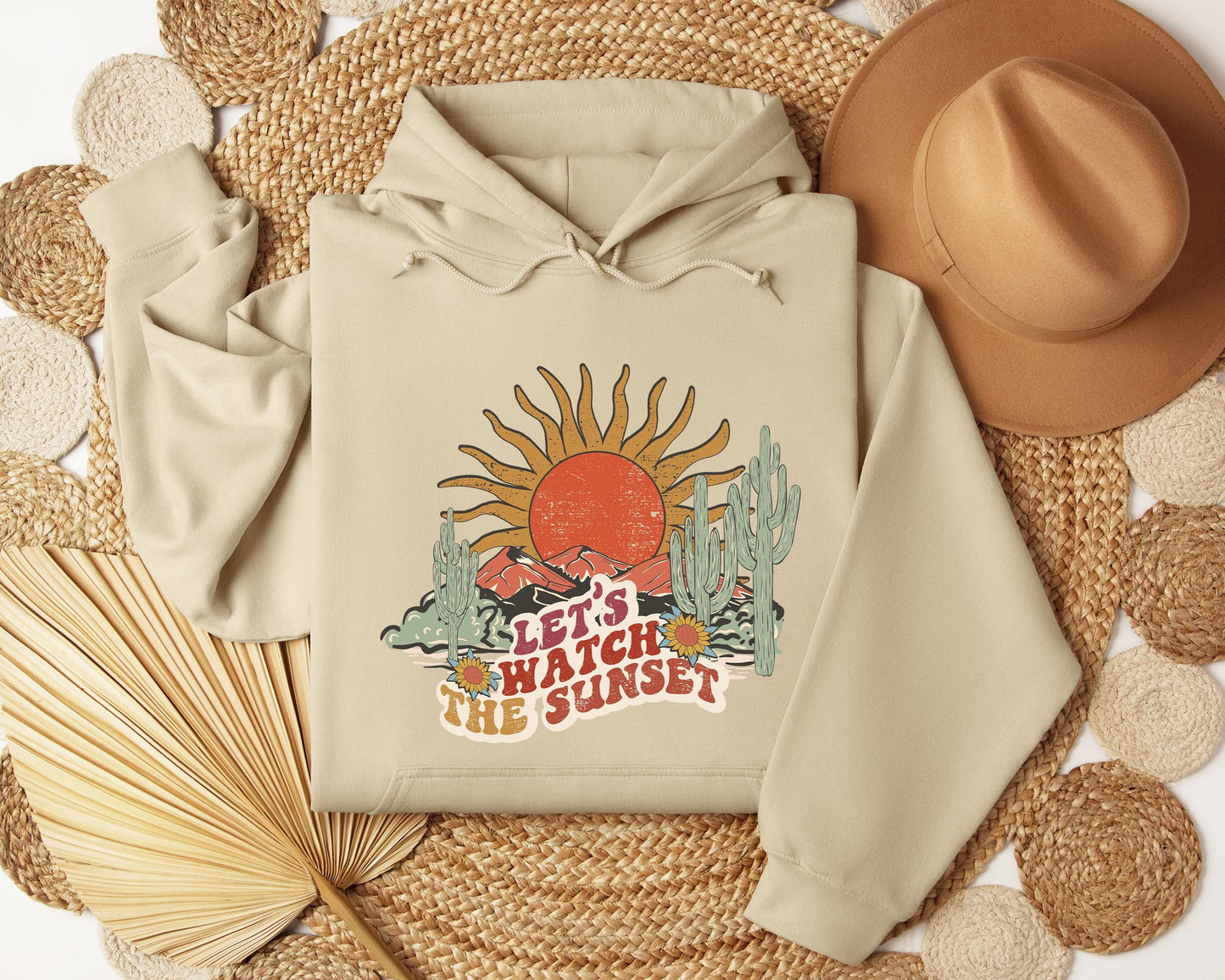 a white hoodie with the words let it wash the sunset on it