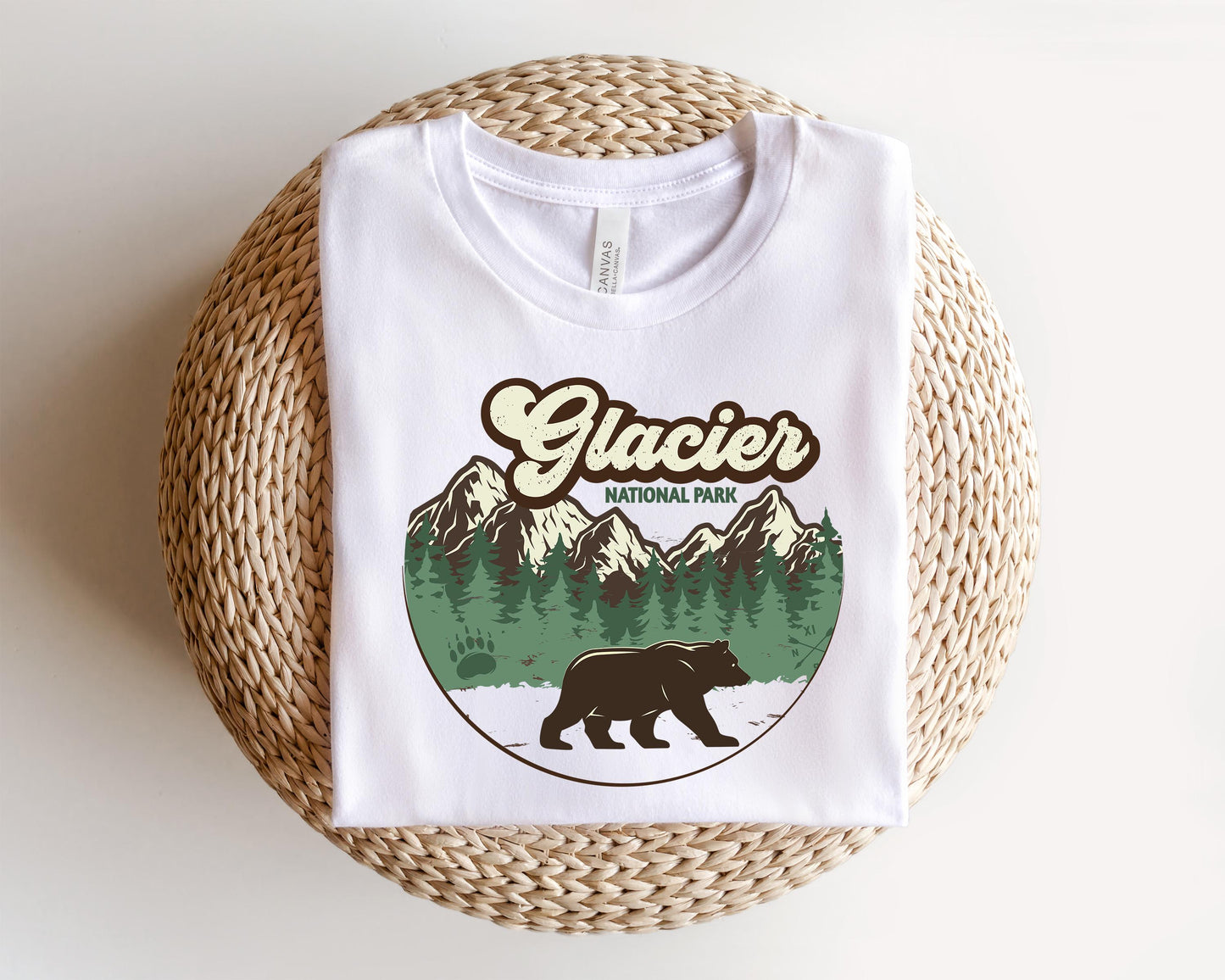 a white t - shirt with a brown bear on it