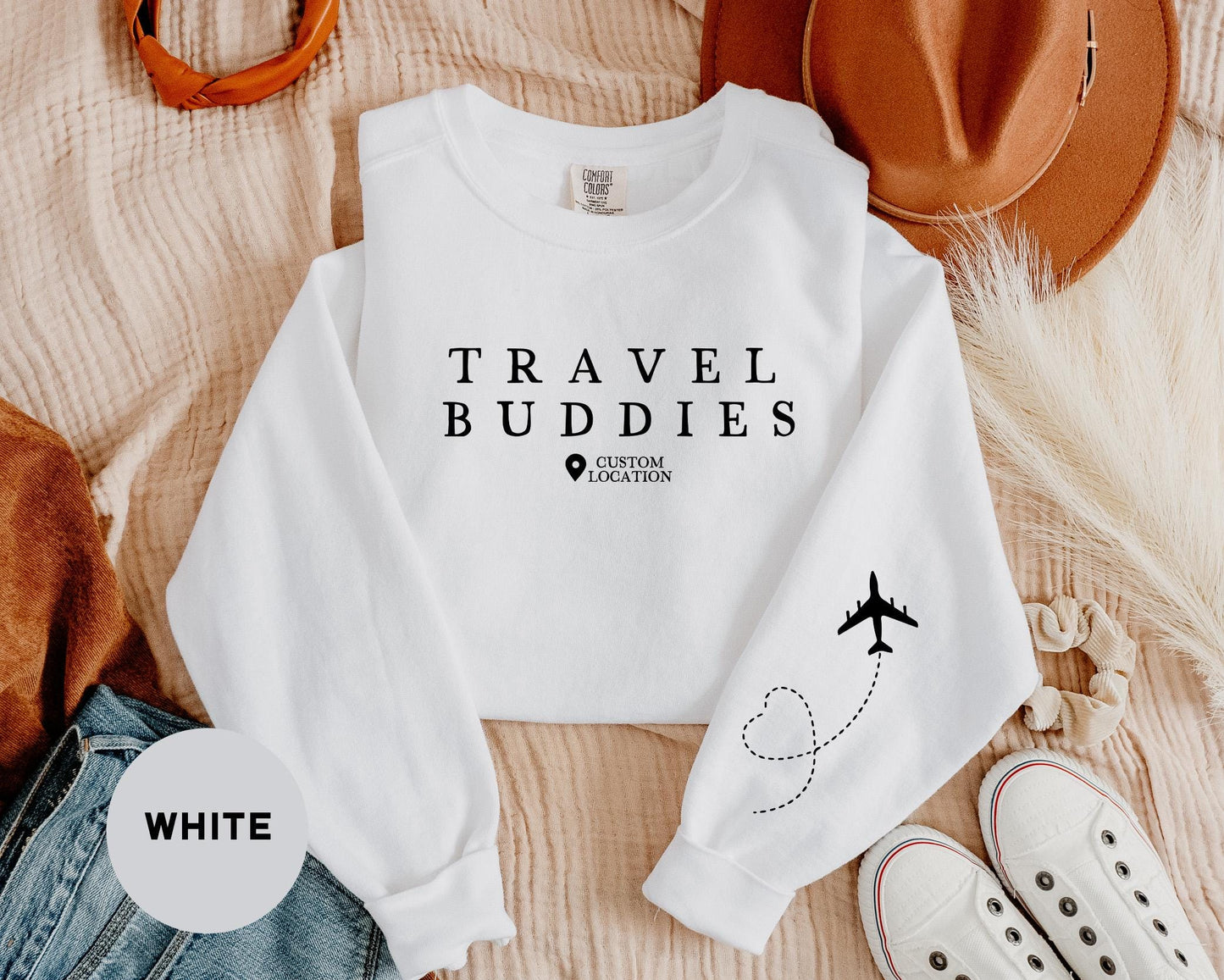 a white sweatshirt with the words travel buddies printed on it