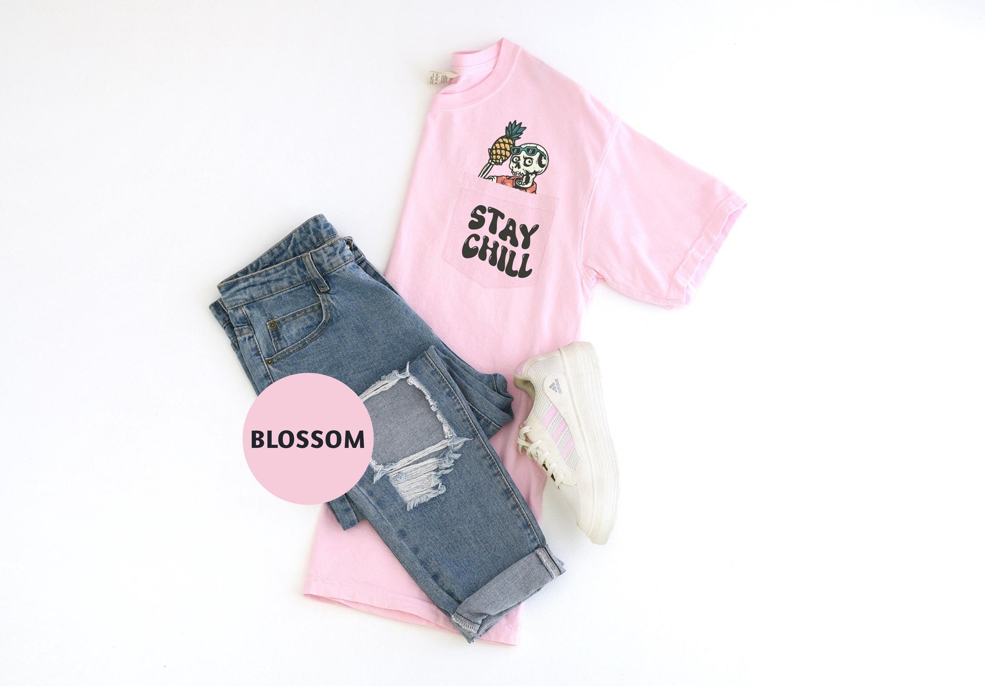 a pink shirt, jeans, and sneakers on a white background