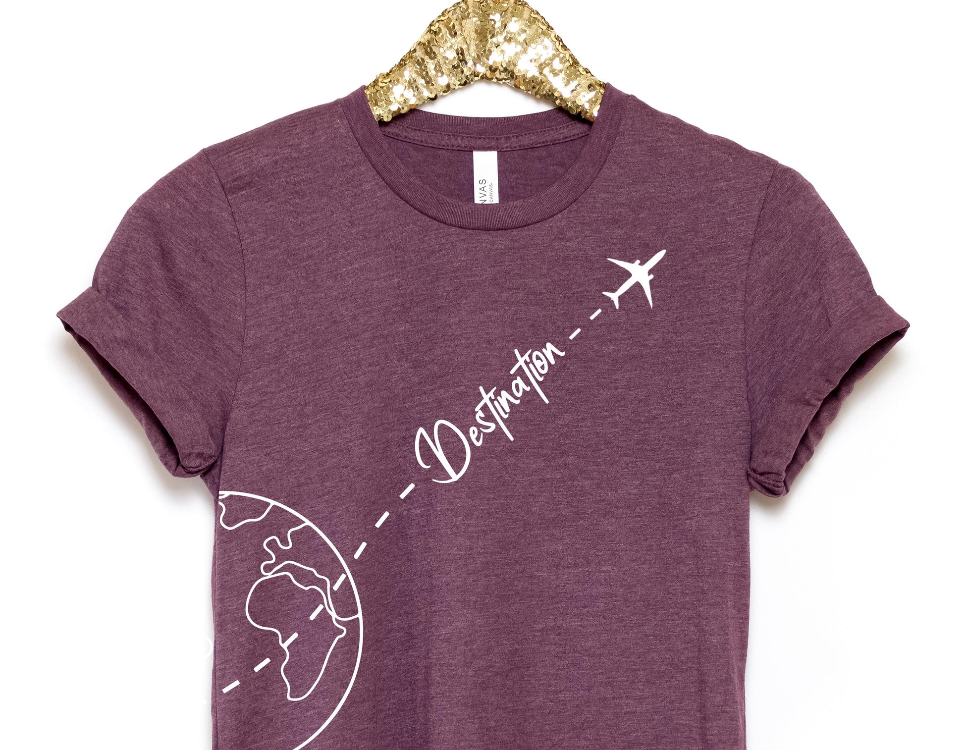 a t - shirt with a picture of the earth and a plane on it