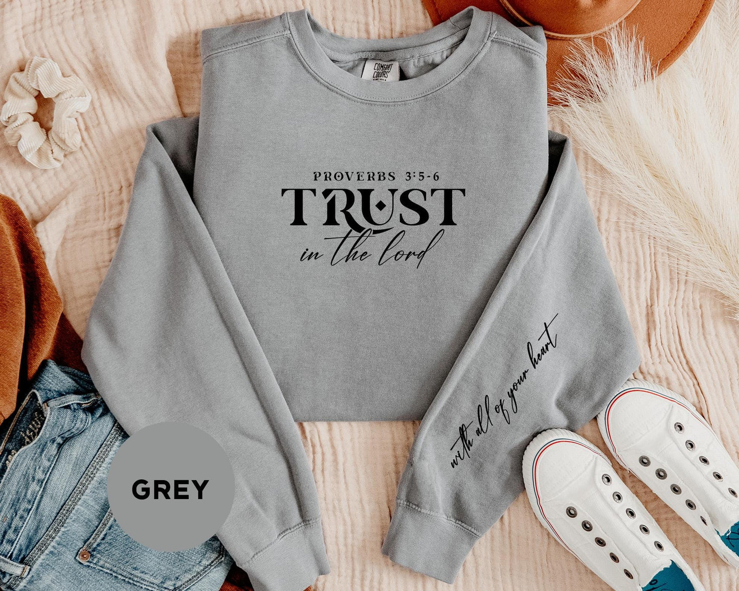 a grey sweatshirt with the words trust in the lord on it