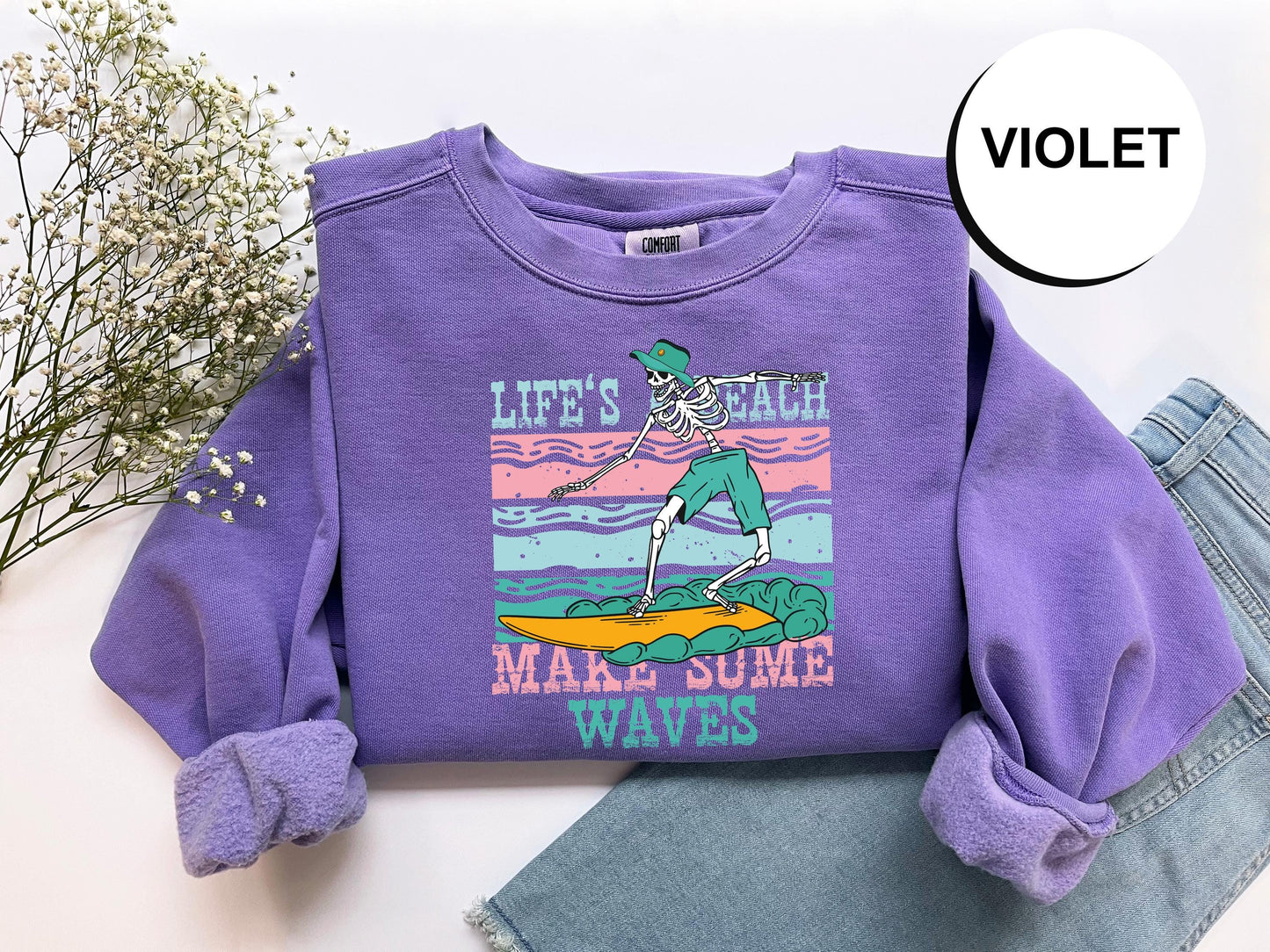 a purple shirt with a skeleton on it