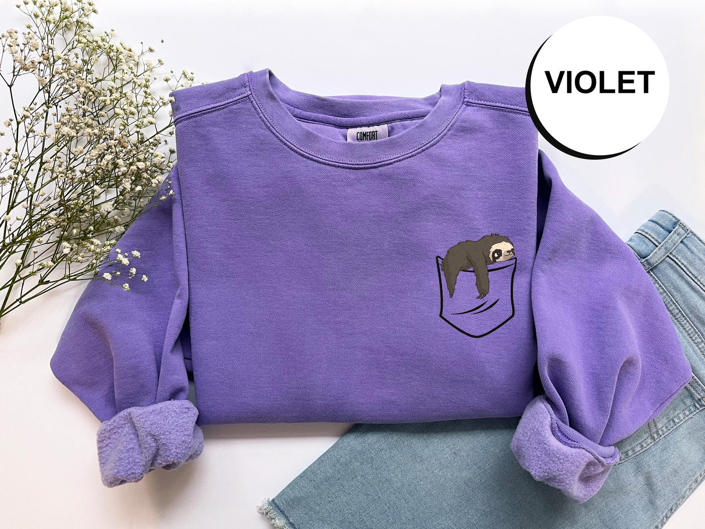 a purple shirt with a slotter in the pocket