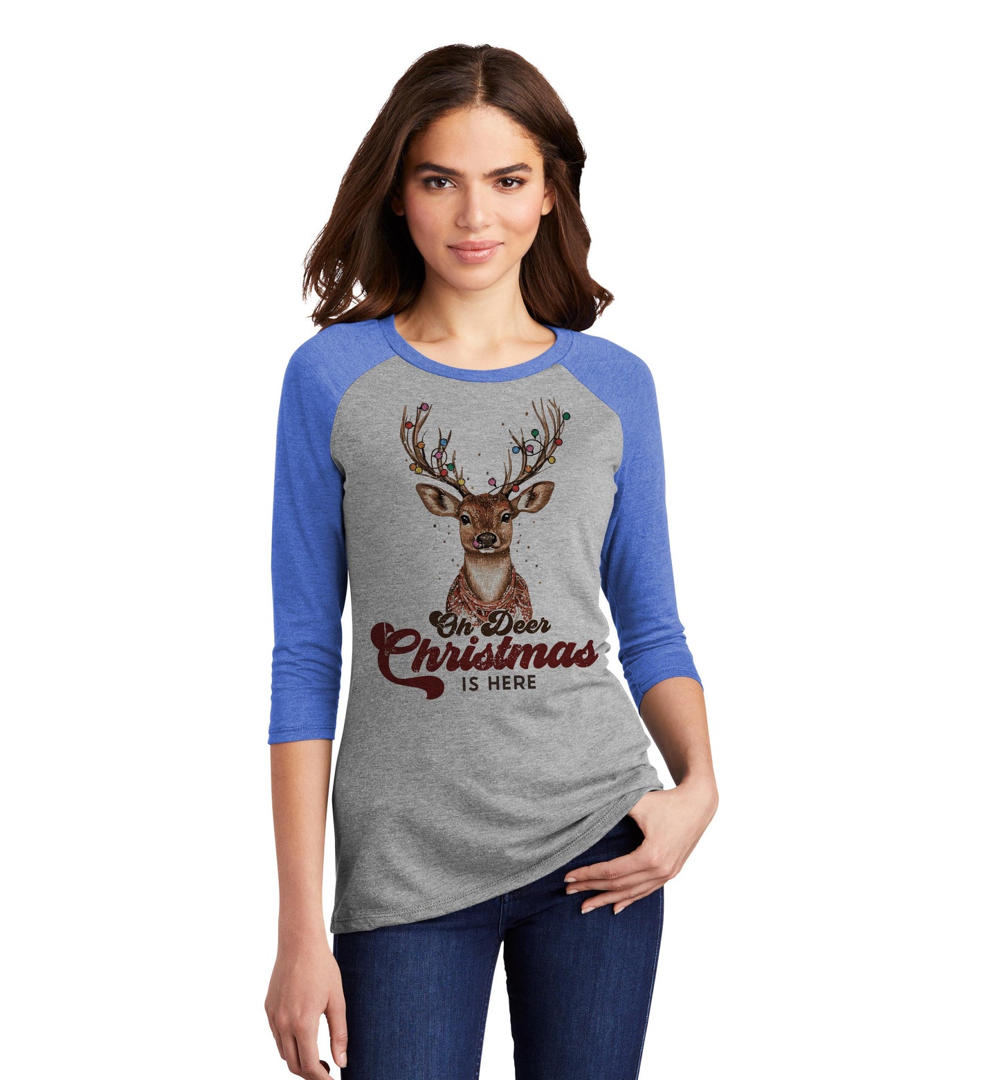 a woman wearing a grey and blue shirt with a deer on it