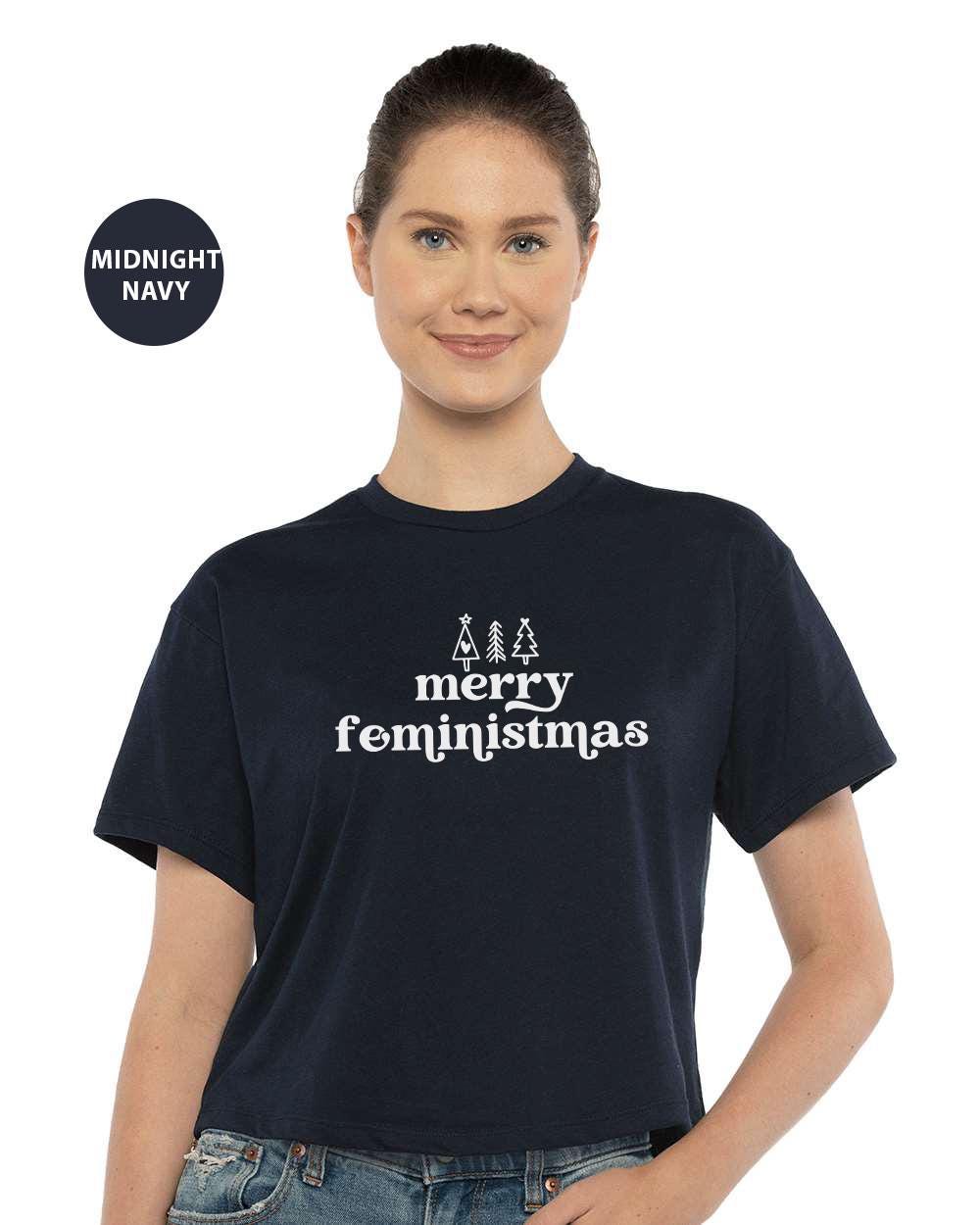 a woman wearing a merry christmas t - shirt