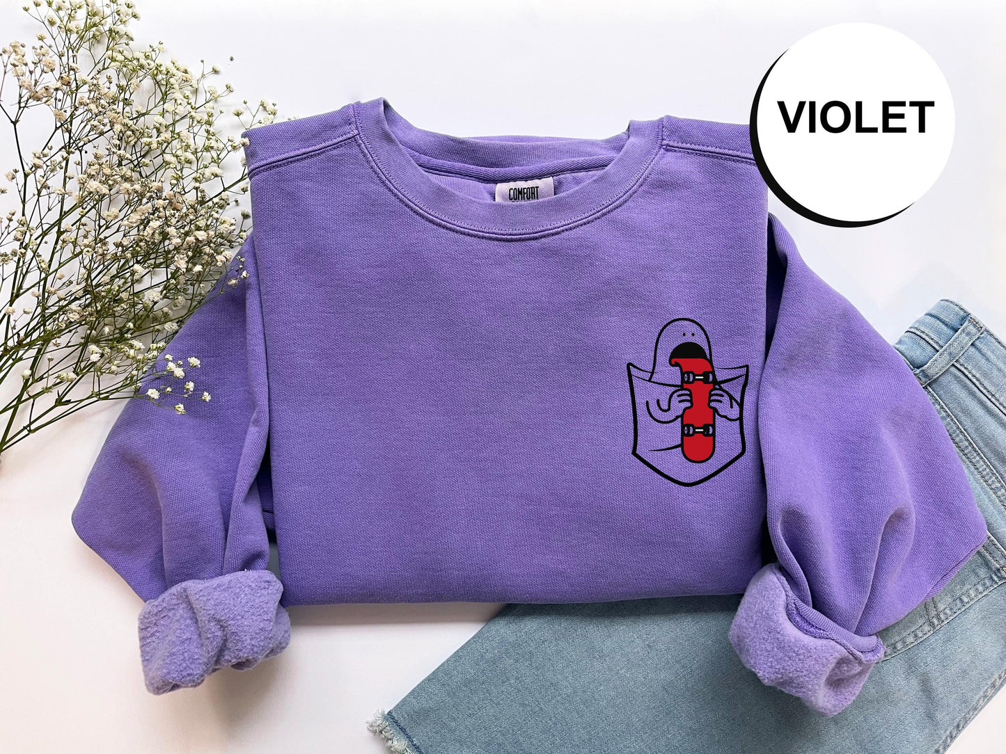 a purple sweater with a picture of a woman's face on it