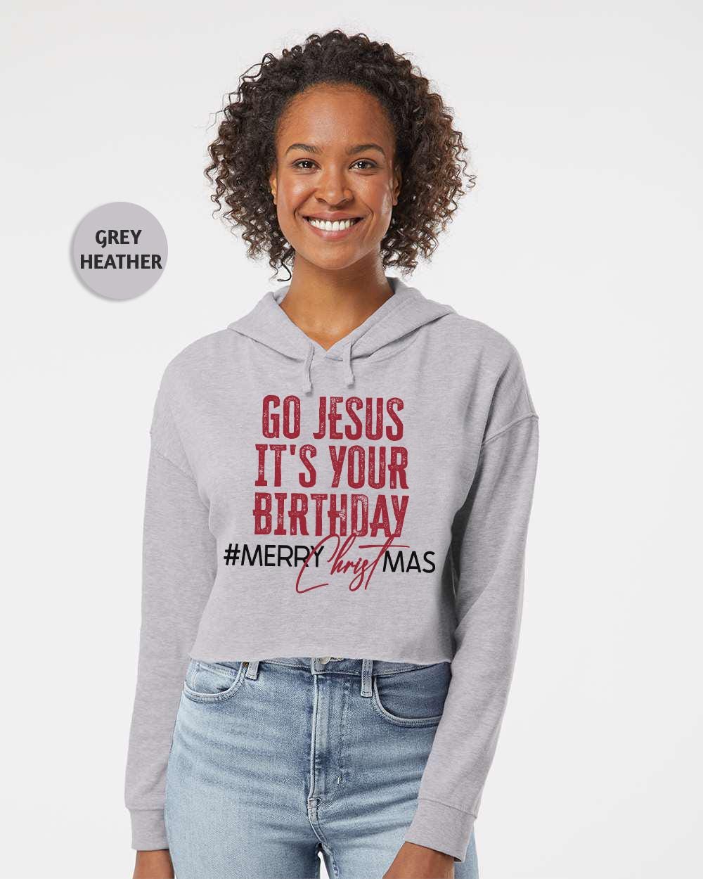 a woman wearing a sweatshirt that says go jesus it's your birthday merry christmas