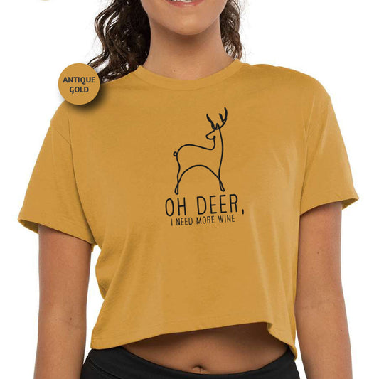 a woman wearing a crop top with a deer on it
