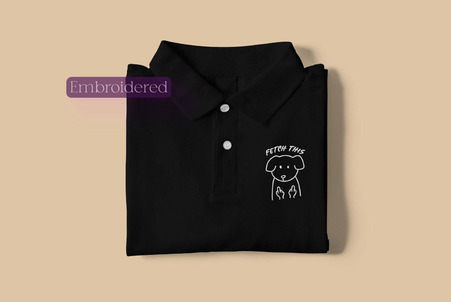 a black polo shirt with a picture of a dog on it