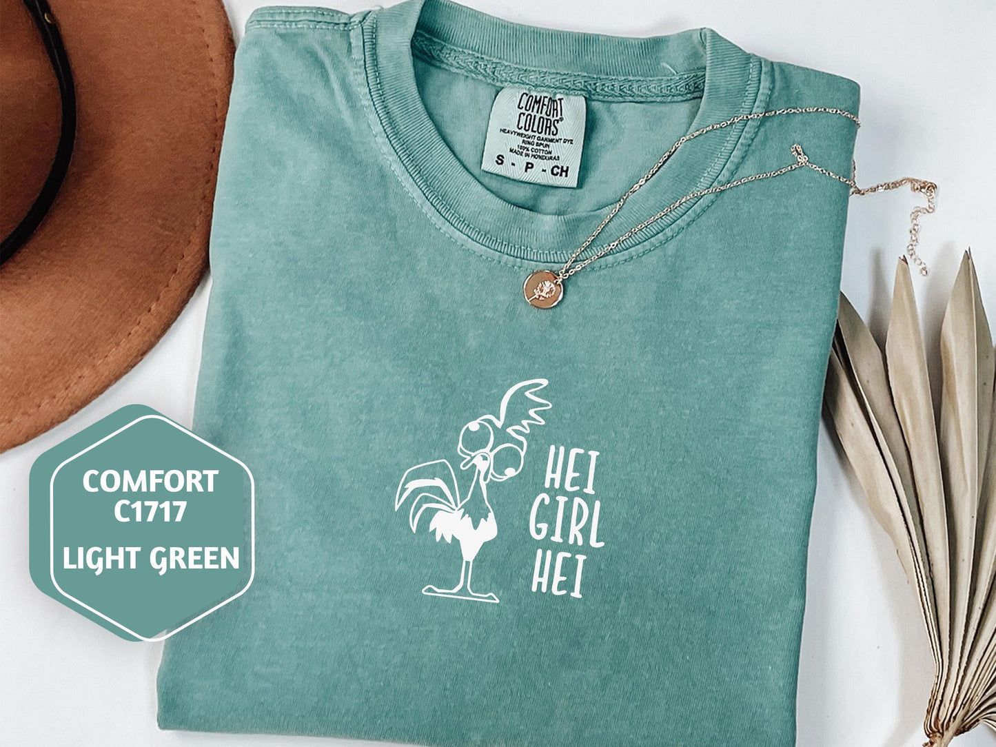 a t - shirt with a picture of a rooster on it