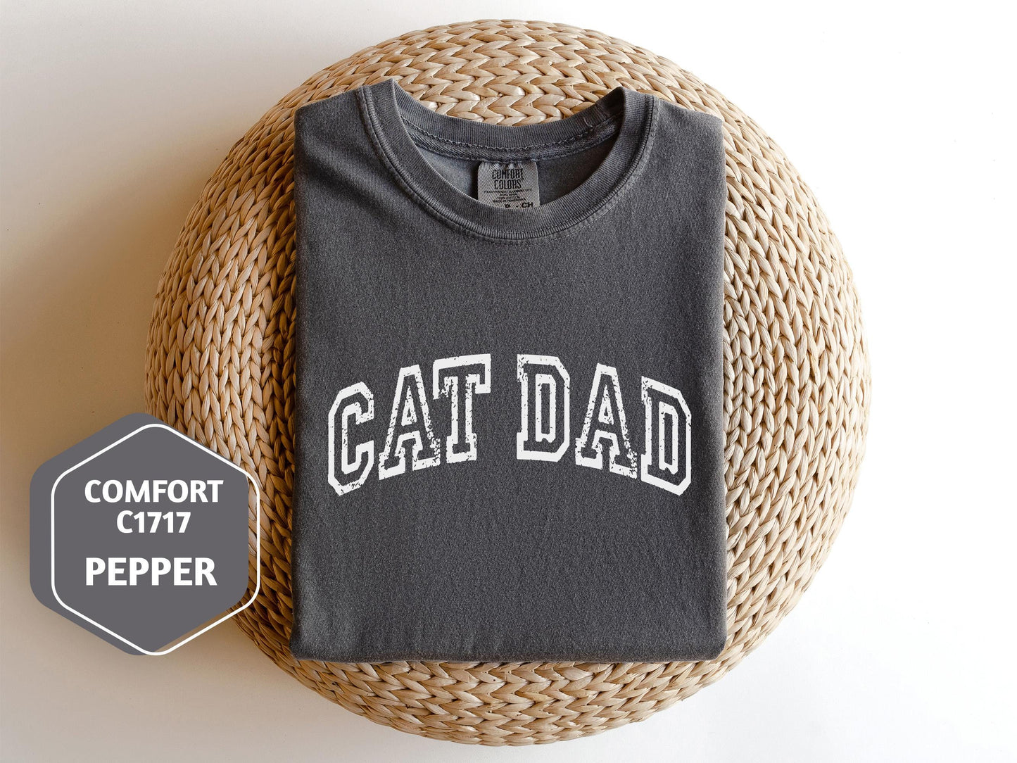 a t - shirt with the word cat dad on it