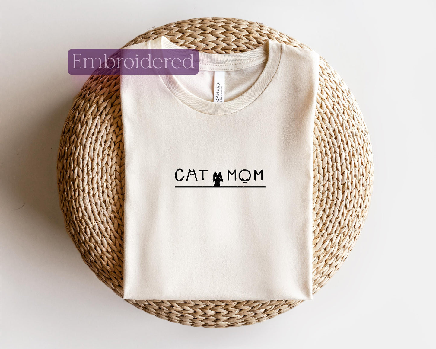 a t - shirt with the word cat mom printed on it