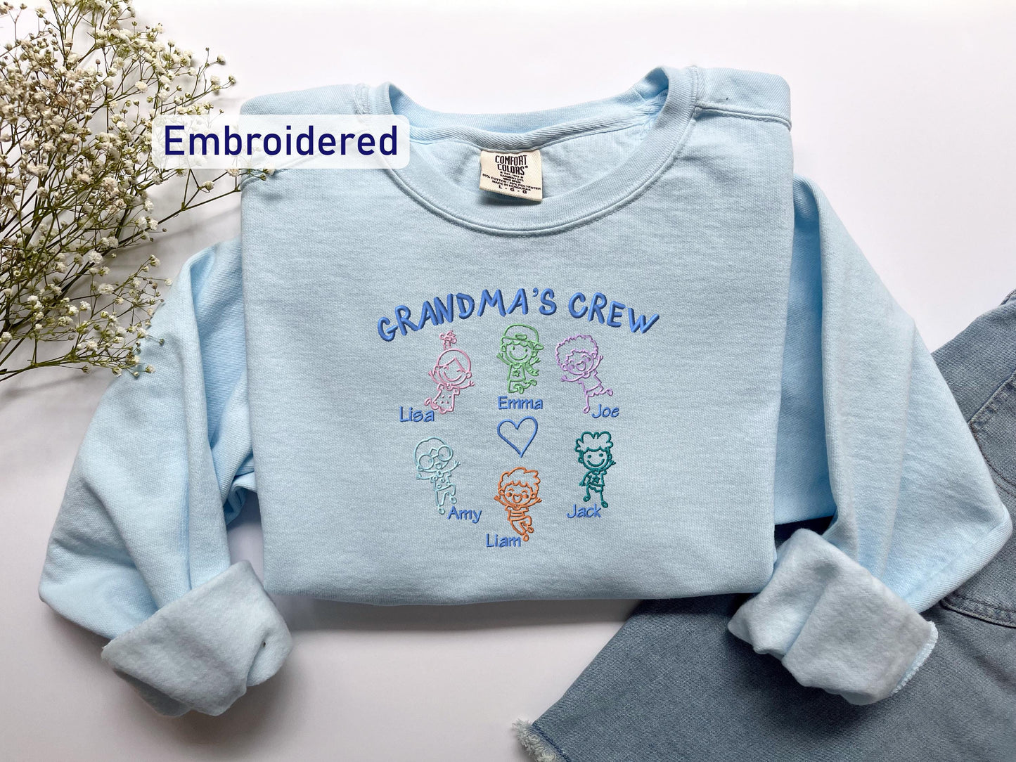 a blue shirt with the words grandma's crew on it