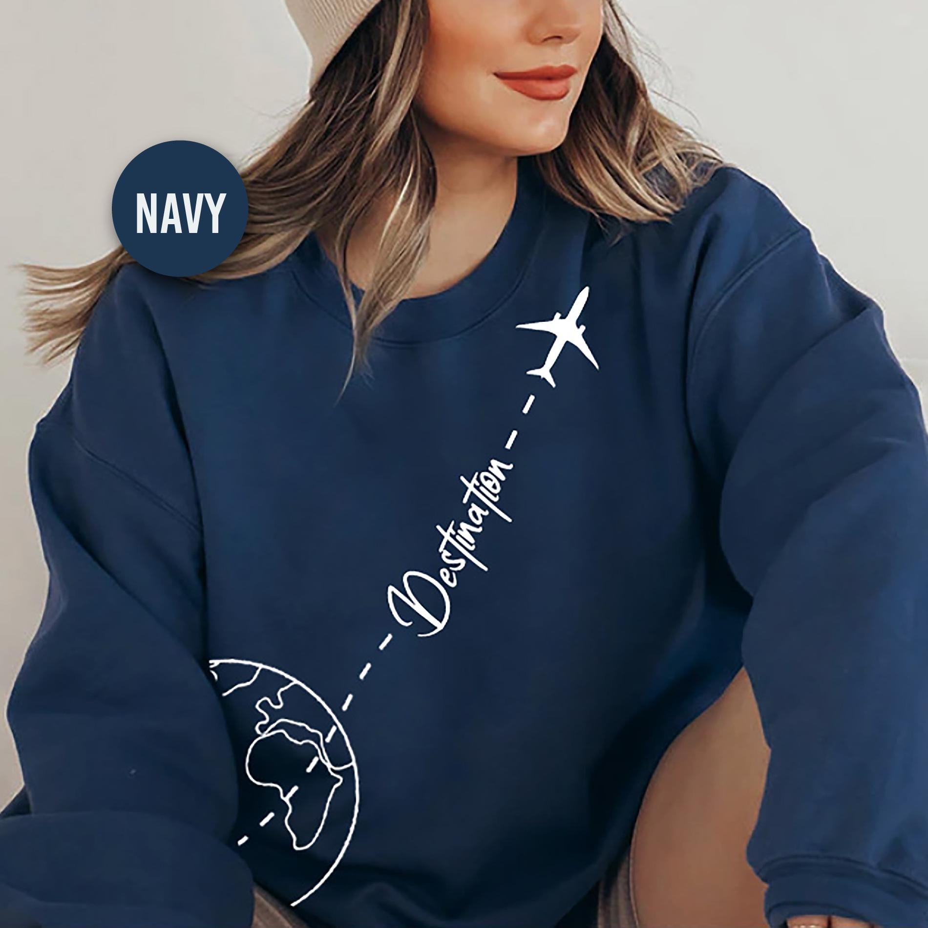 a woman wearing a hat and a sweatshirt